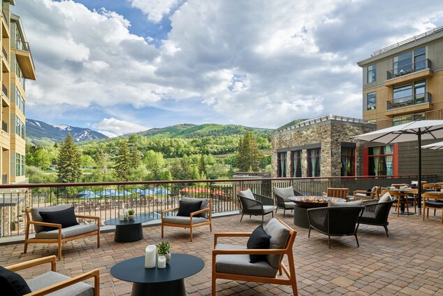 Outdoor patio, tables, fire pit, mountain view