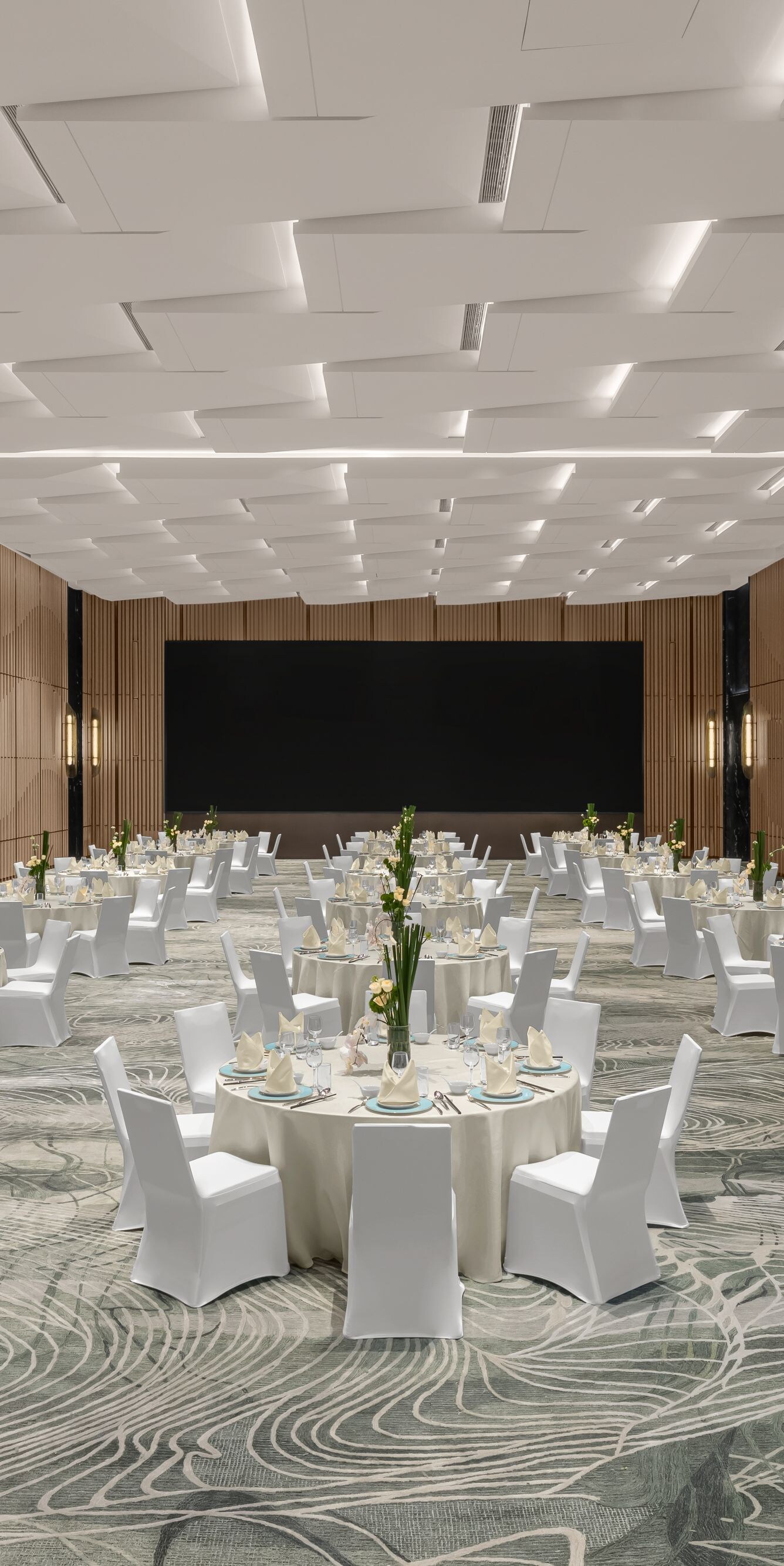 Ballroom set with round tables.