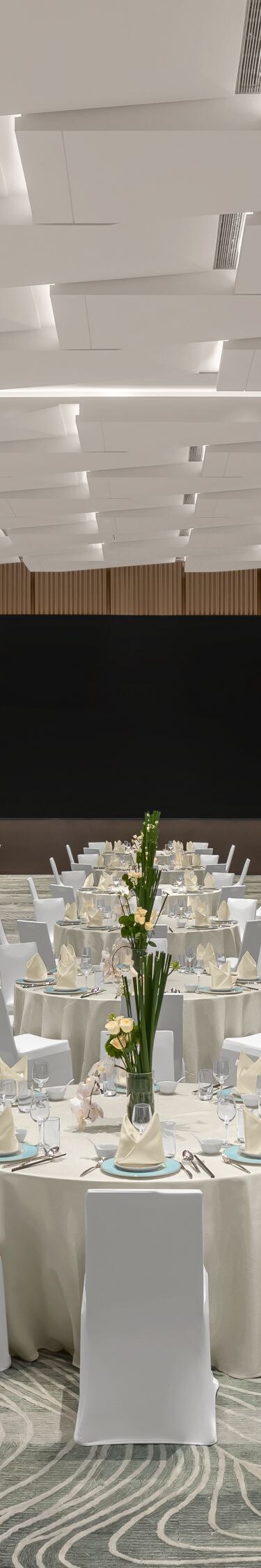 Ballroom set with round tables.