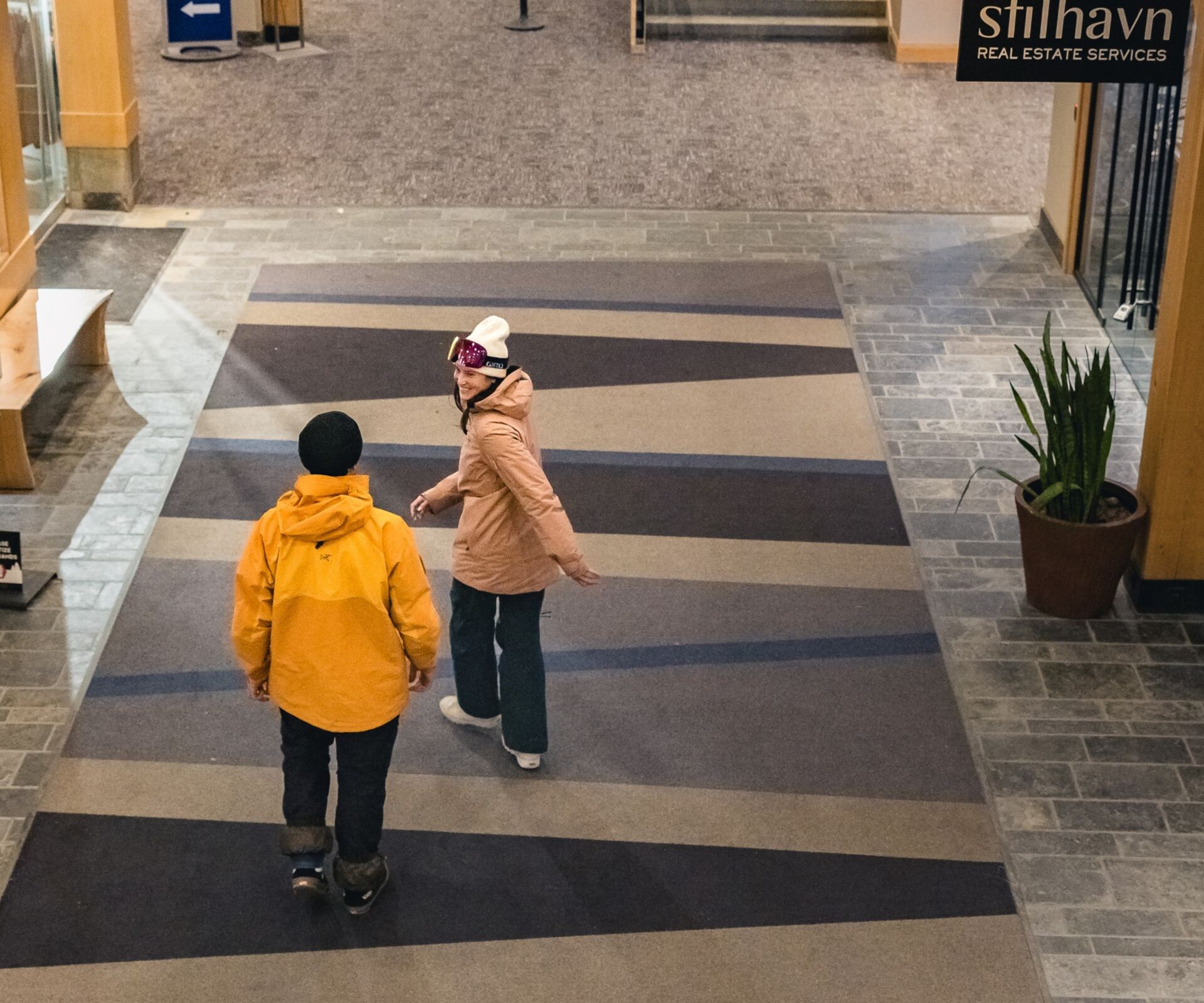 Couple picking up skis from Ski Valet