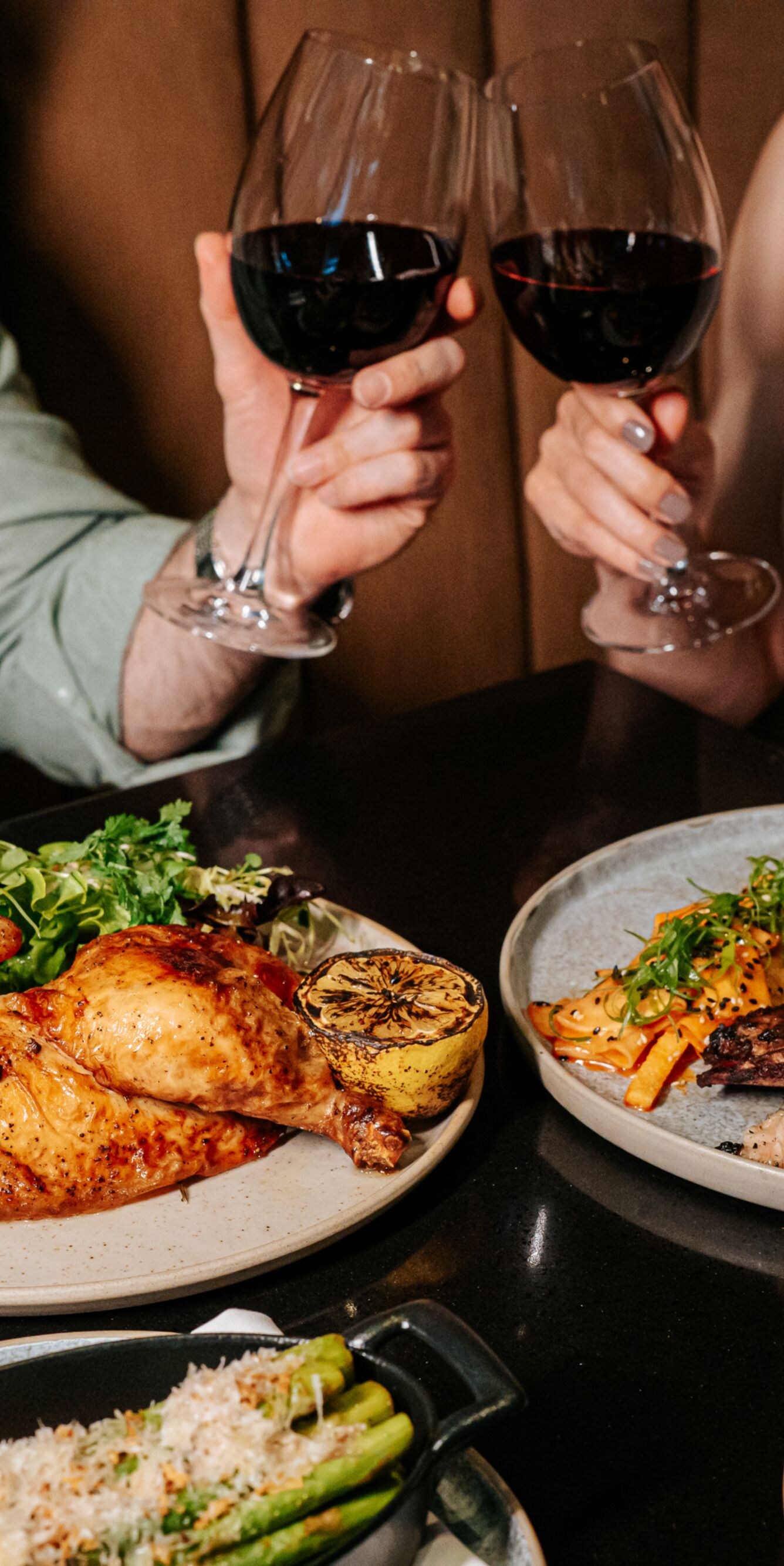 Two people enjoying dinner at the apron