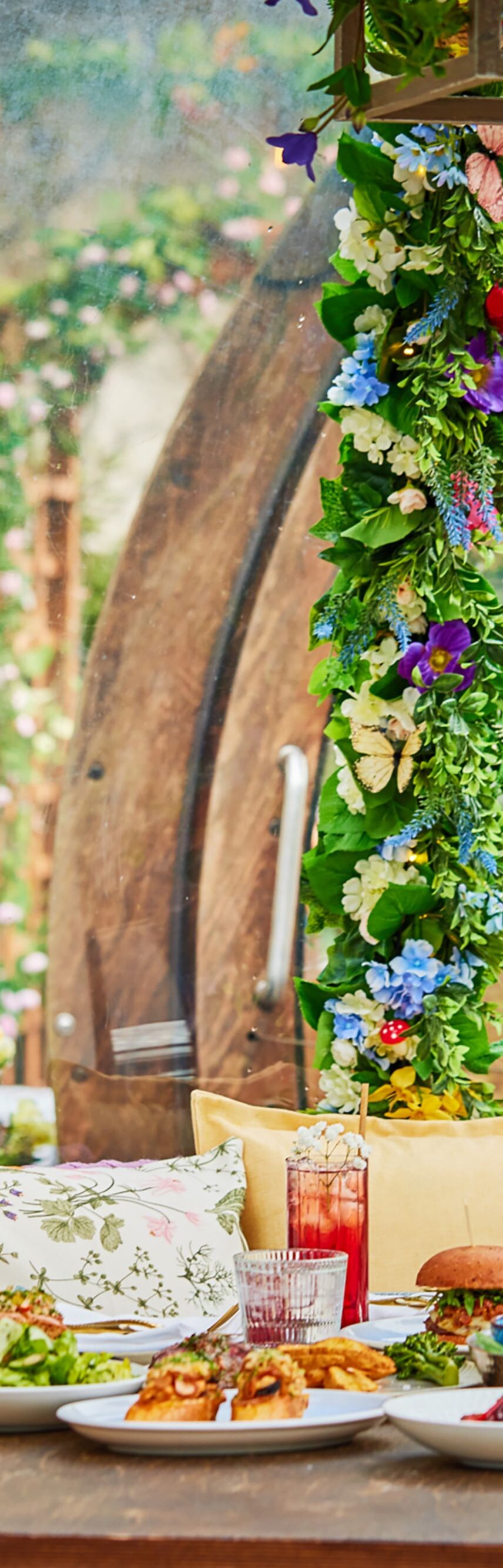 Garden table with dishes and butterfly display