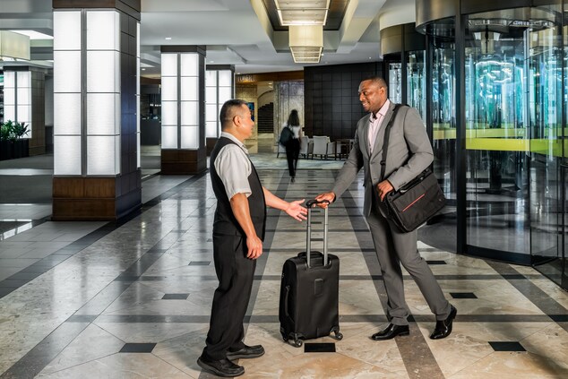 Guest arrival experience with bellman taking bags