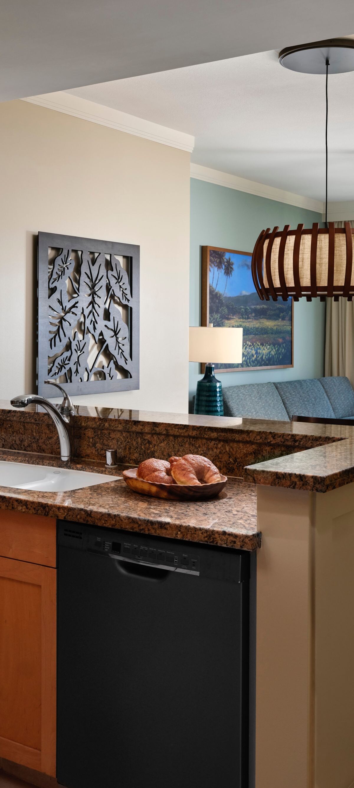 Kitchen, dining table, sofa looking out to island