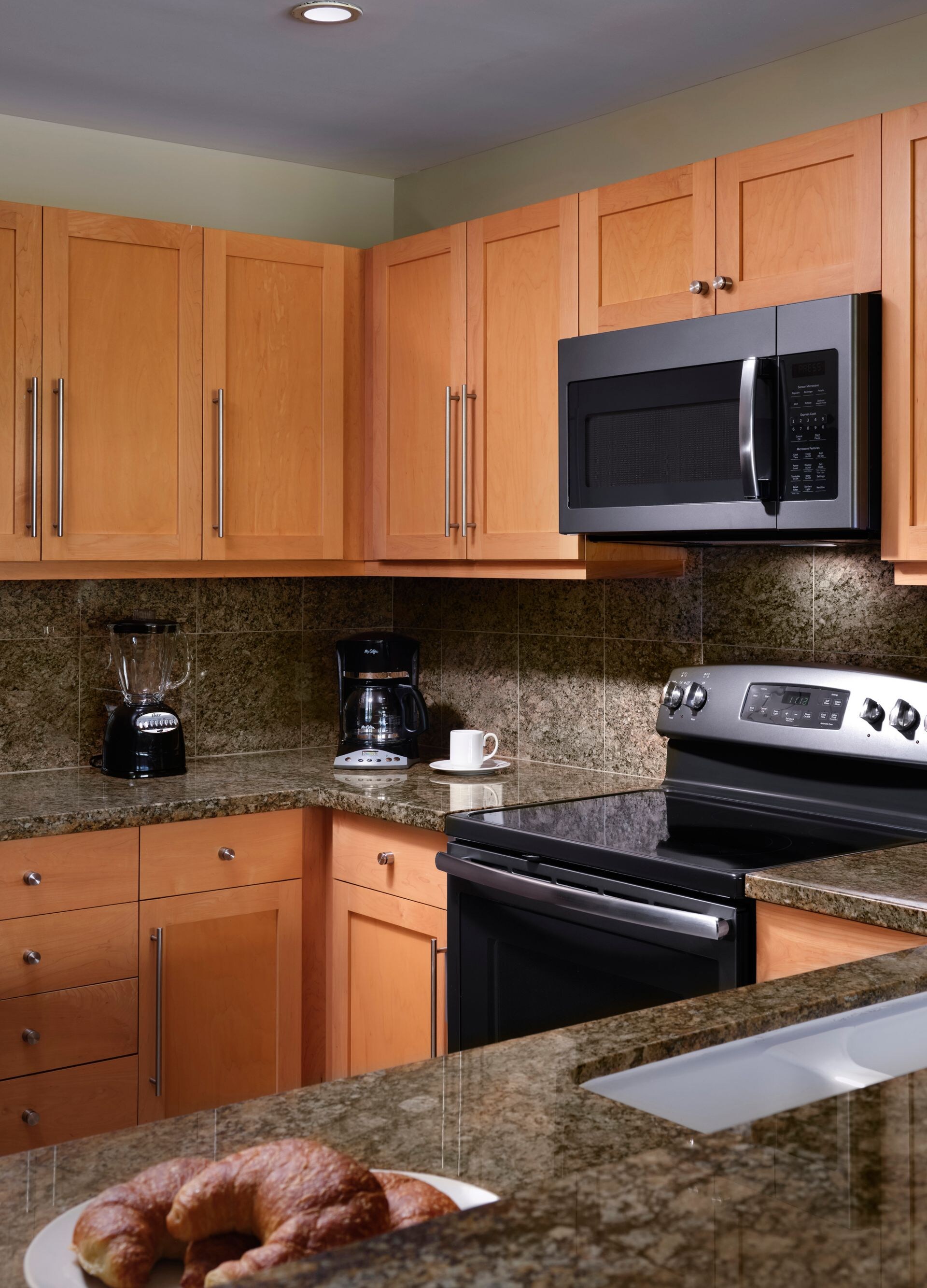 Kitchen with fridge, microwave, oven