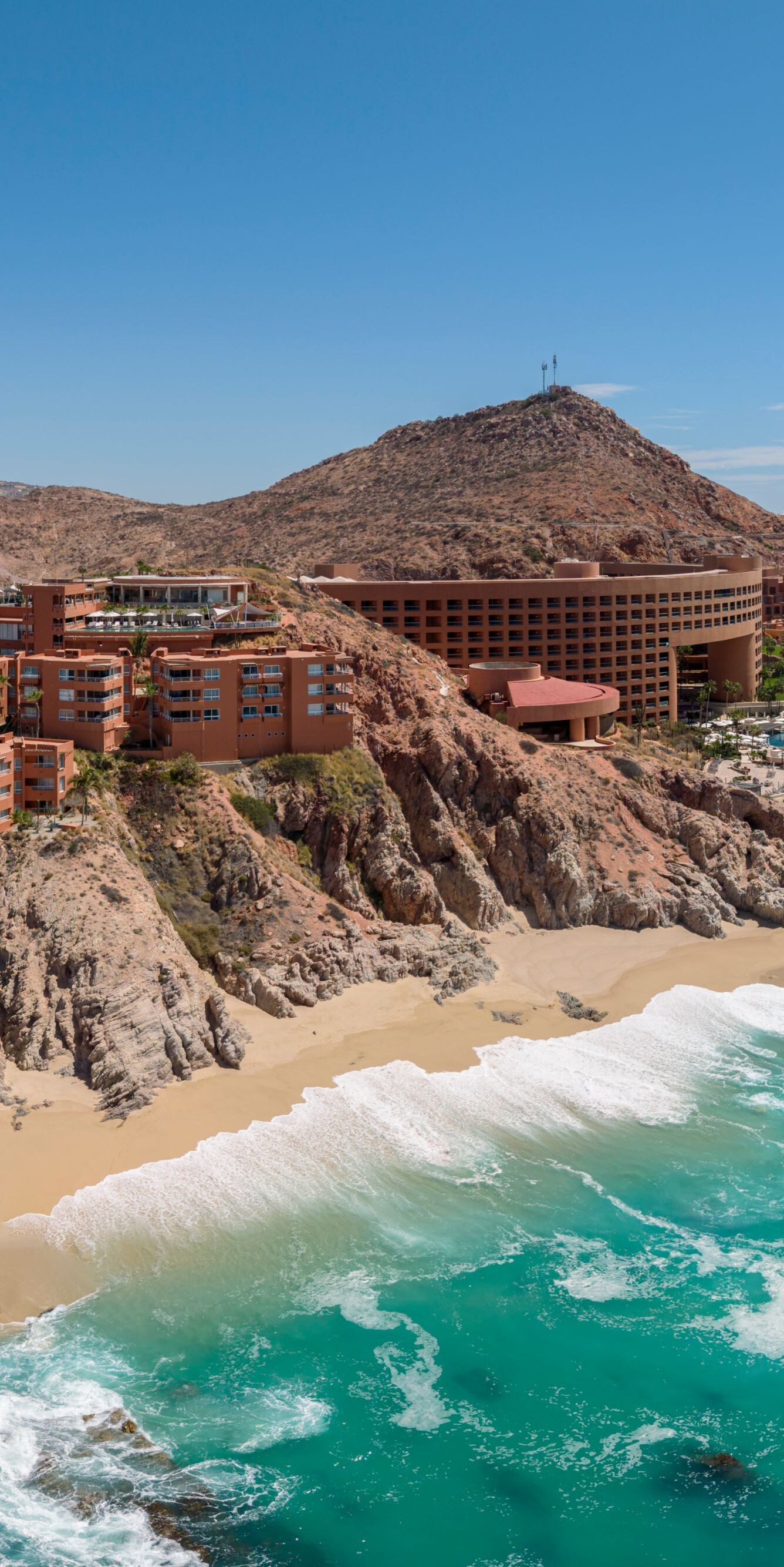 Aerial view of beachfront resort and turquoise sea