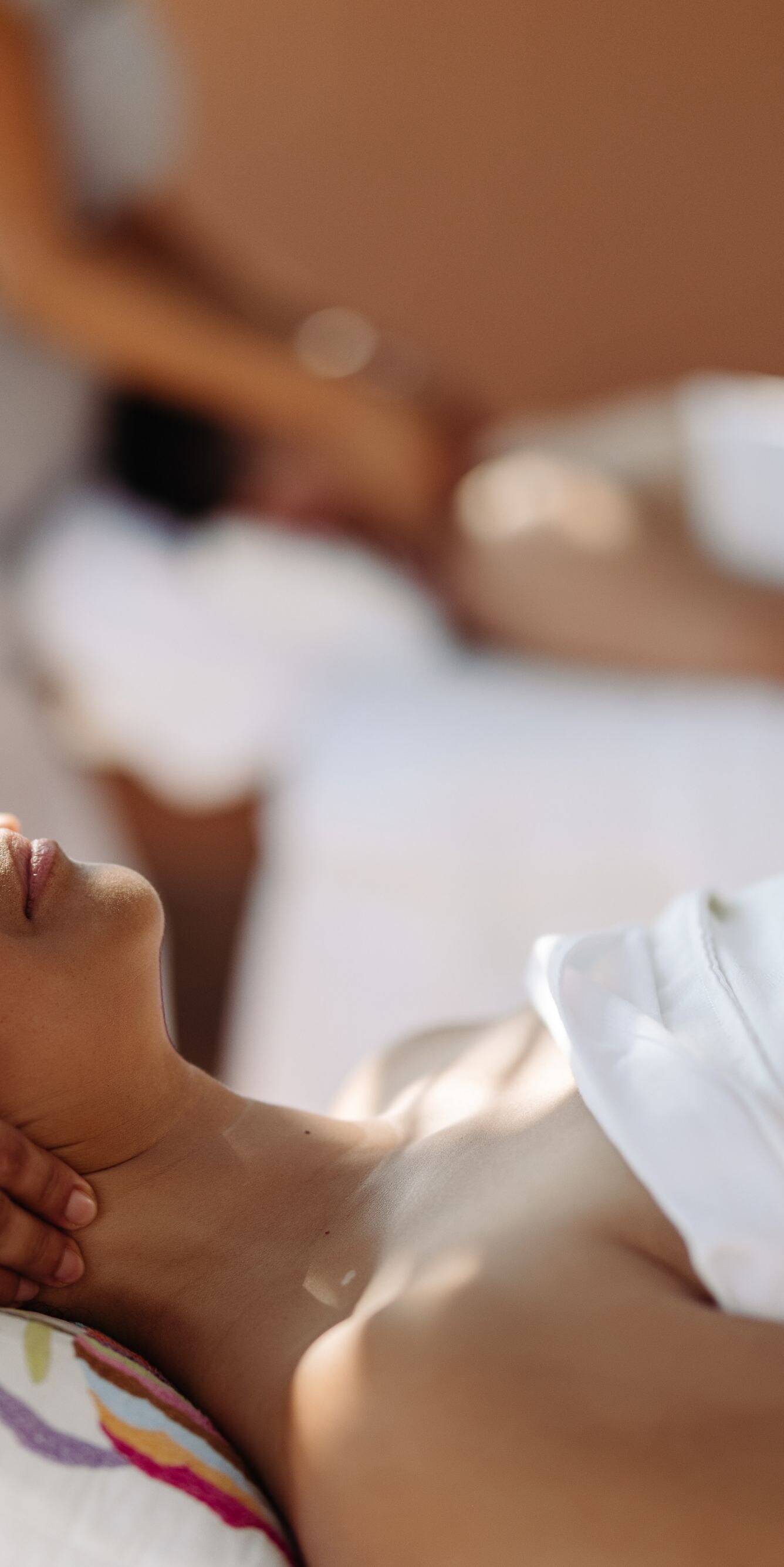 Woman, man having massage in outdoor cabana