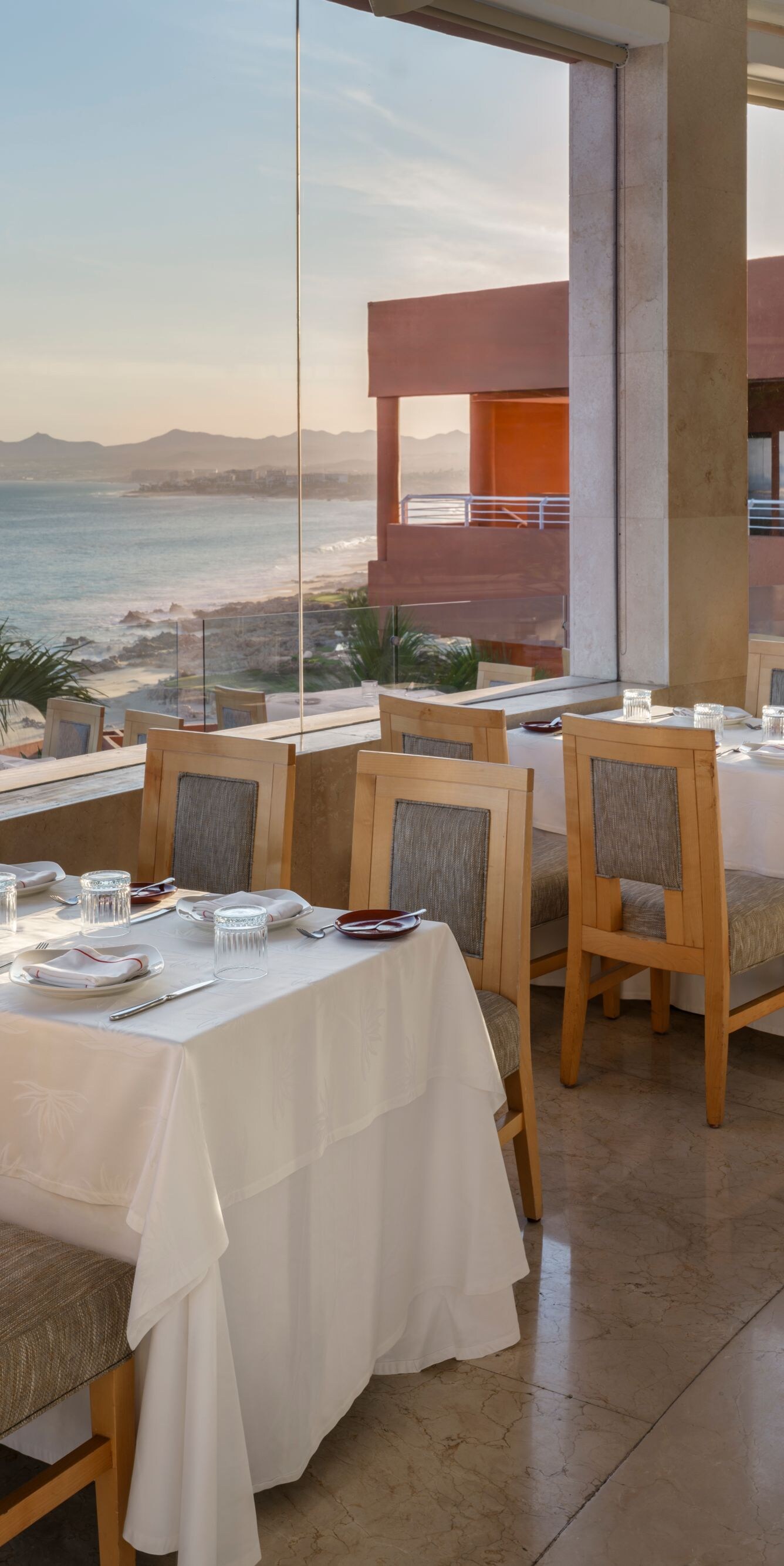 Oceanfront restaurant with tables and sea view