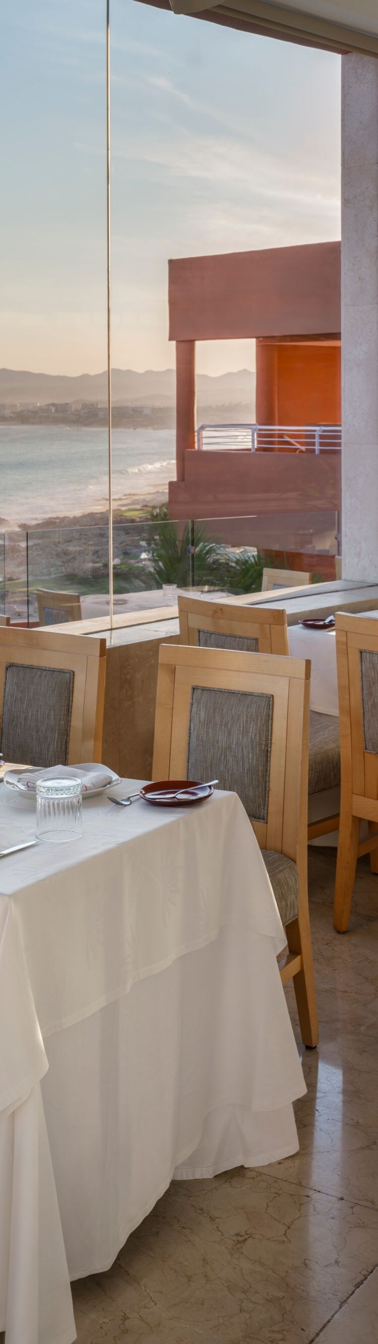 Oceanfront restaurant with tables and sea view