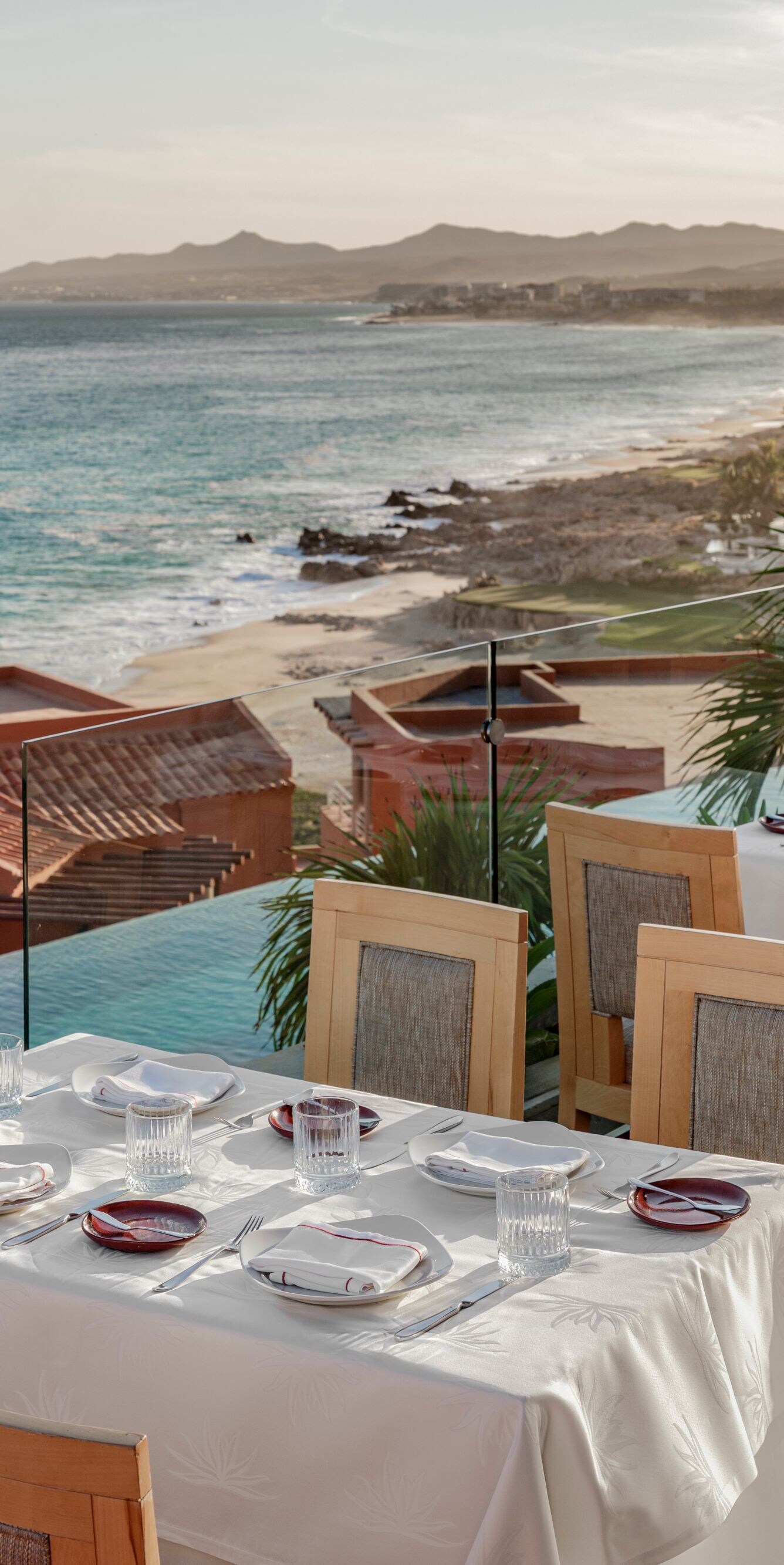 Oceanfront terrace dining with coastal view