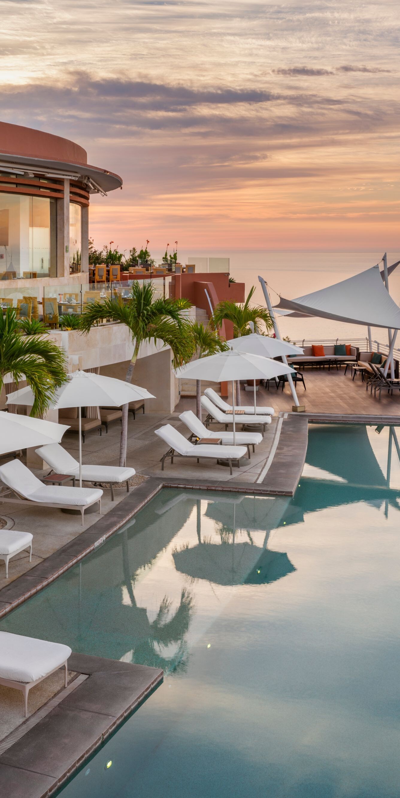 Restaurant exterior with view of ocean at sunset