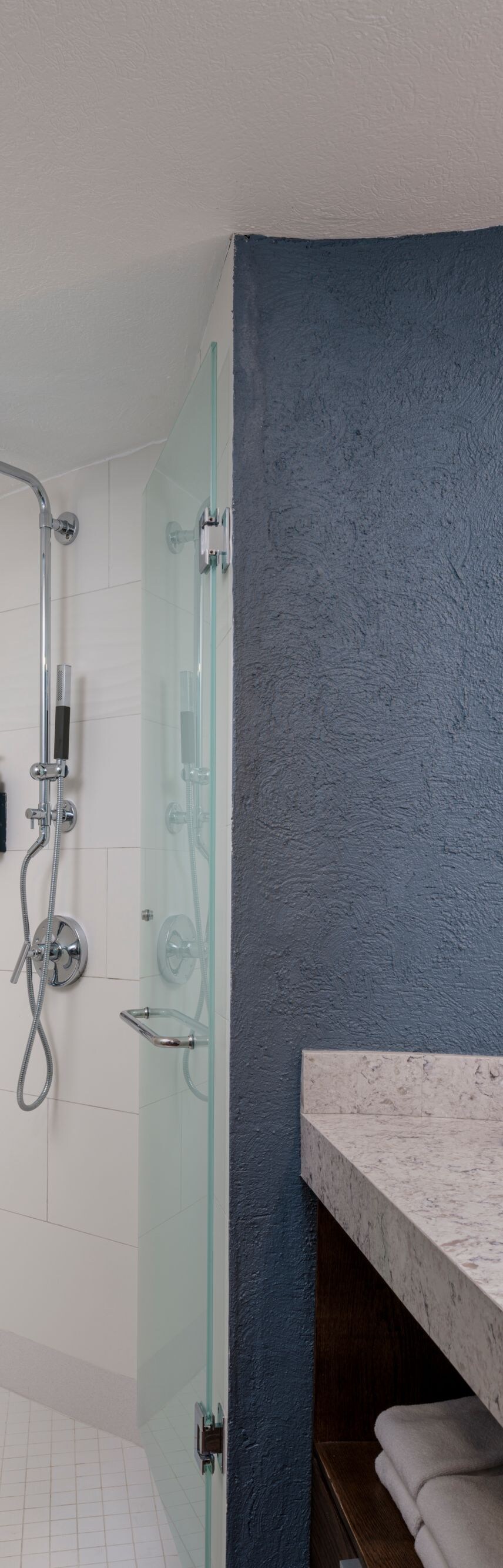 Vanity with one sink and walk-in shower