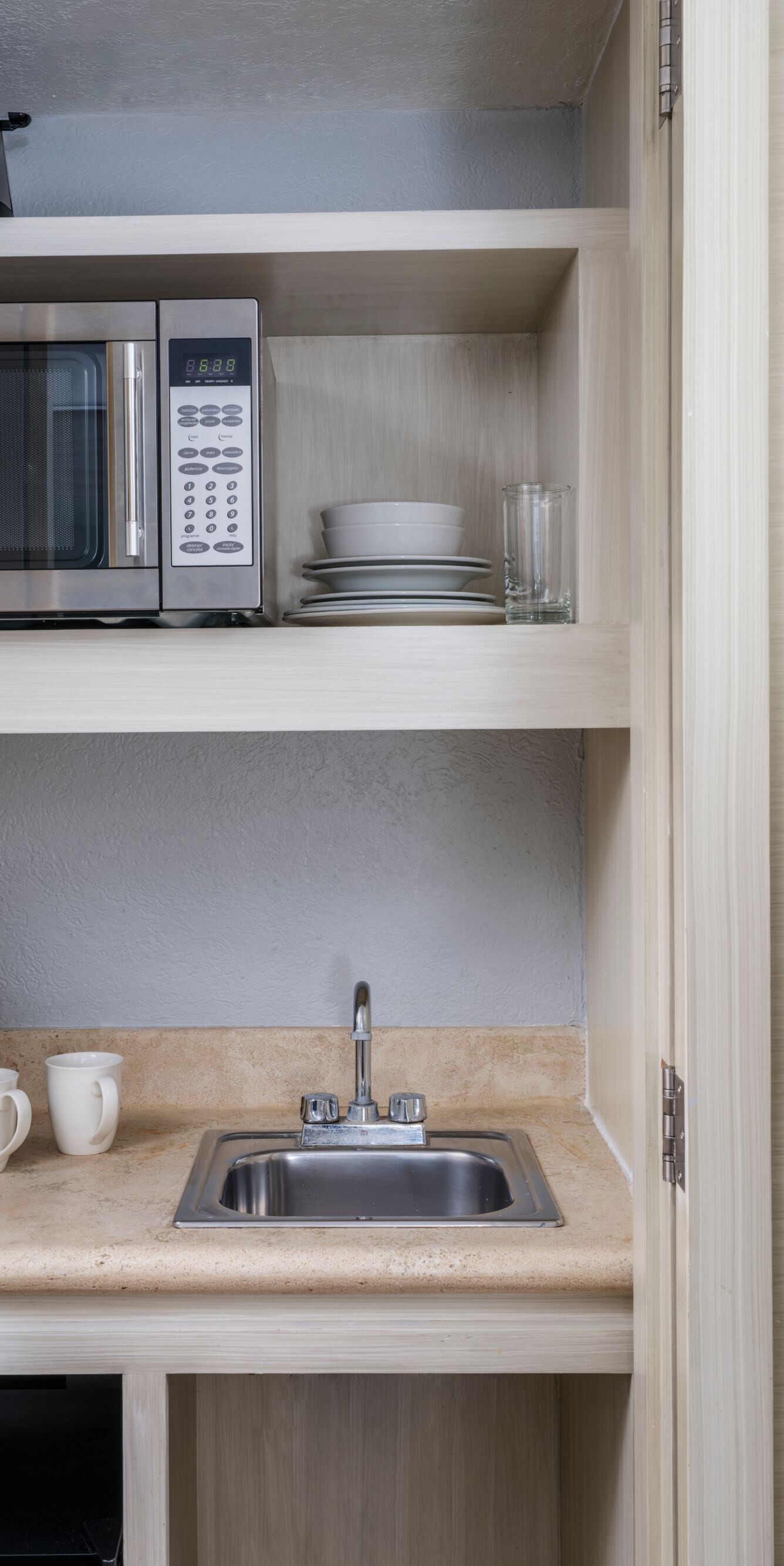 Small fridge, microwave, and coffee maker