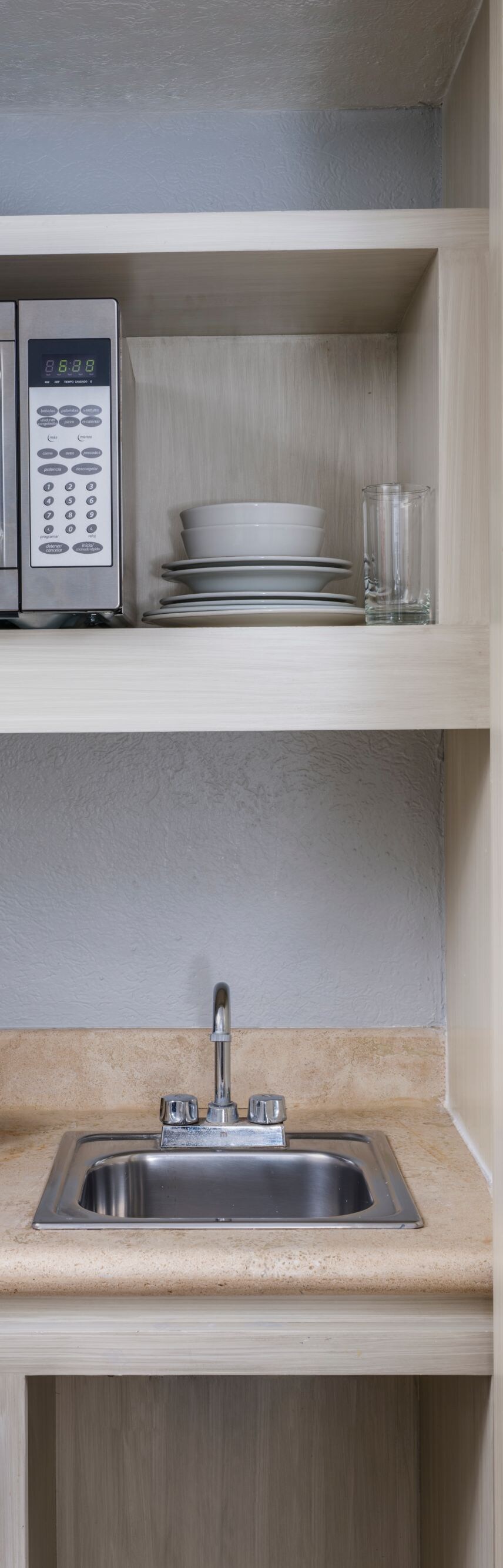 Small fridge, microwave, and coffee maker