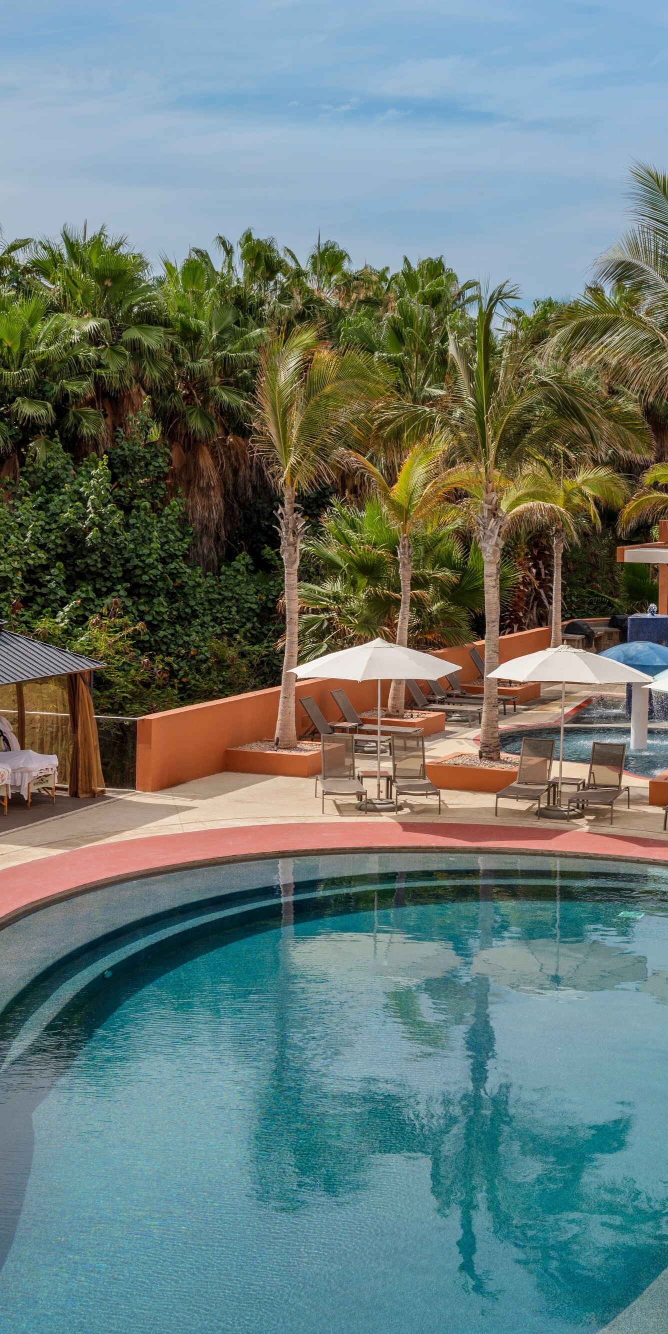 Outdoor resort pool with loungers 