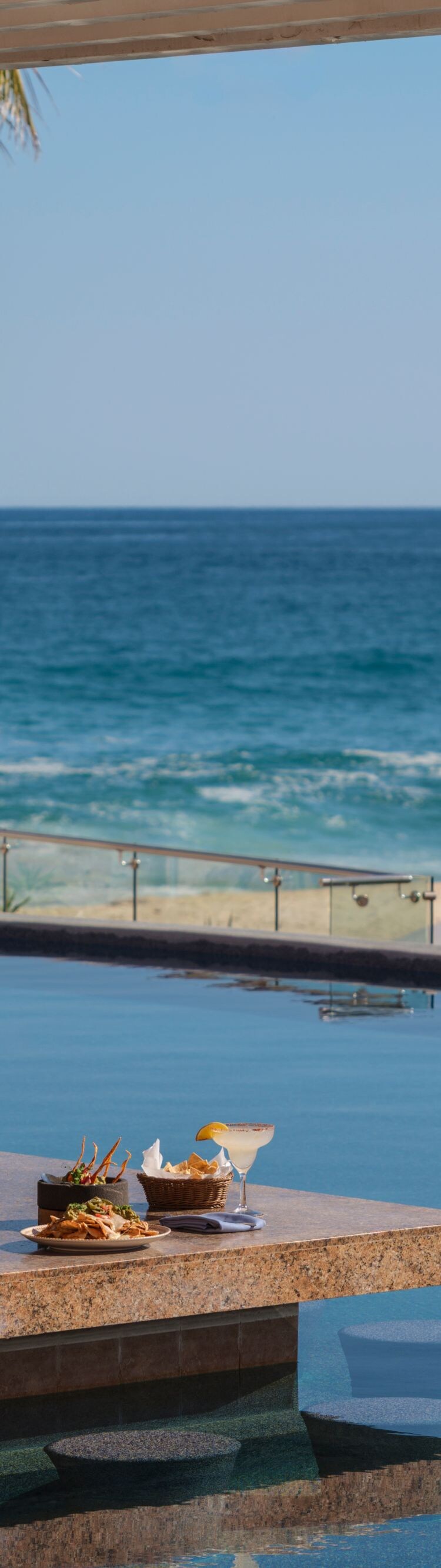Oceanfront resort pool bar in Los Cabos