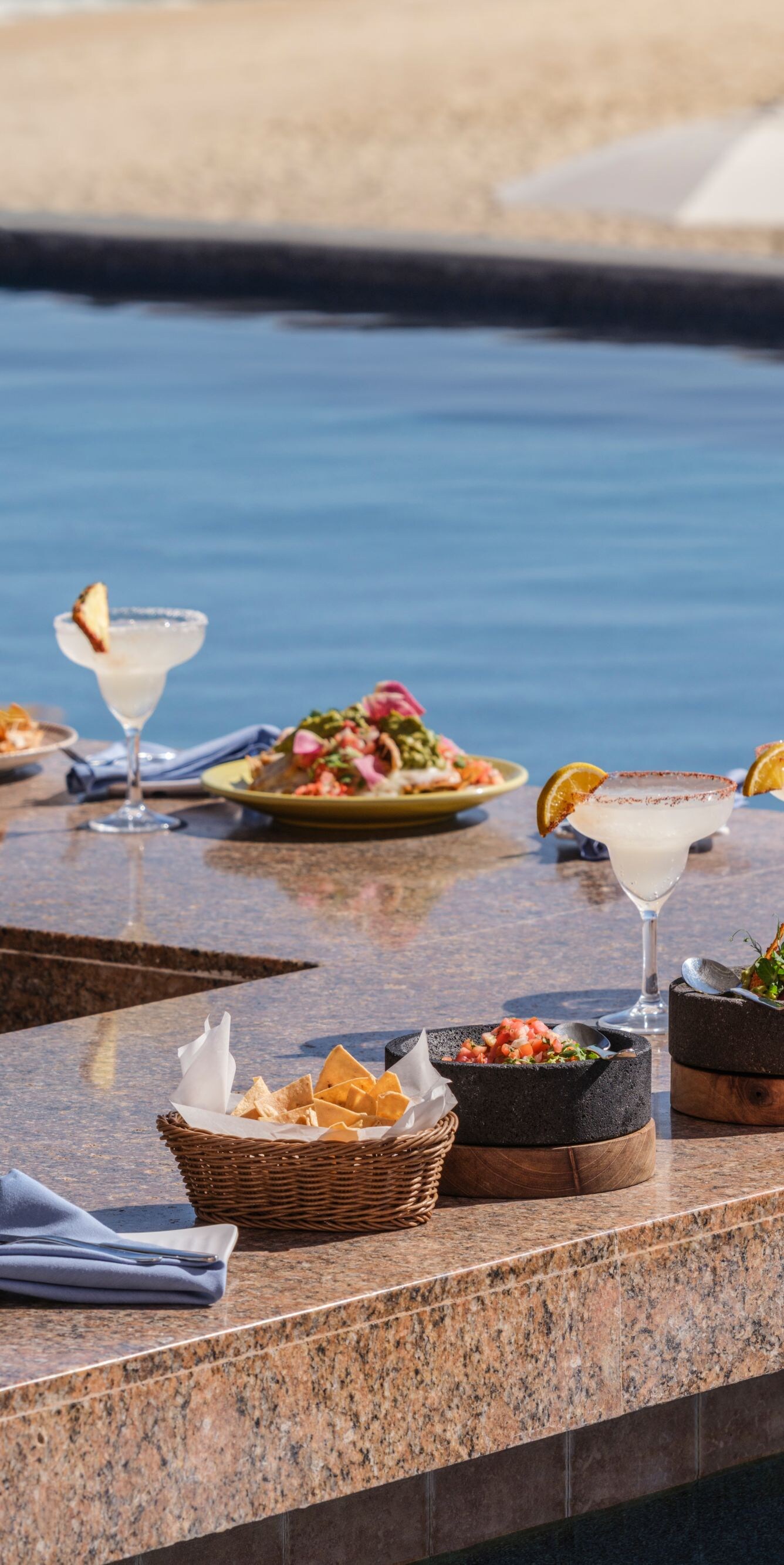 Plated food and drinks on pool bar counter