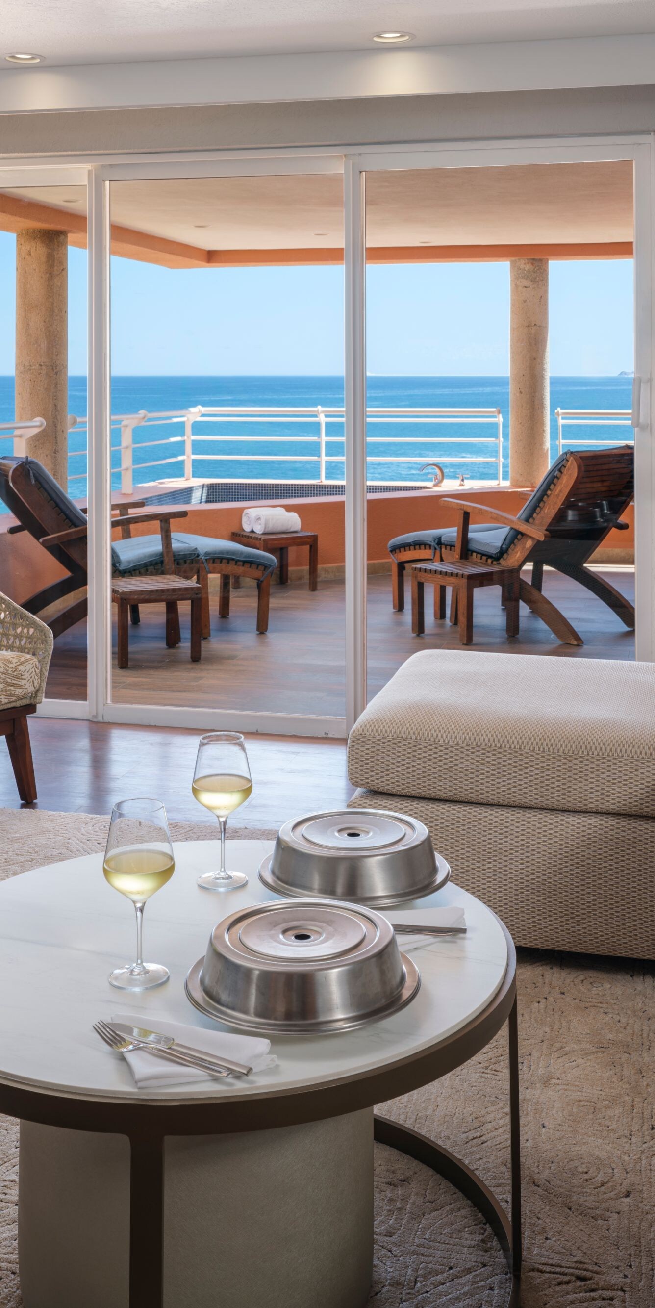 Living area with food and wine on coffee table