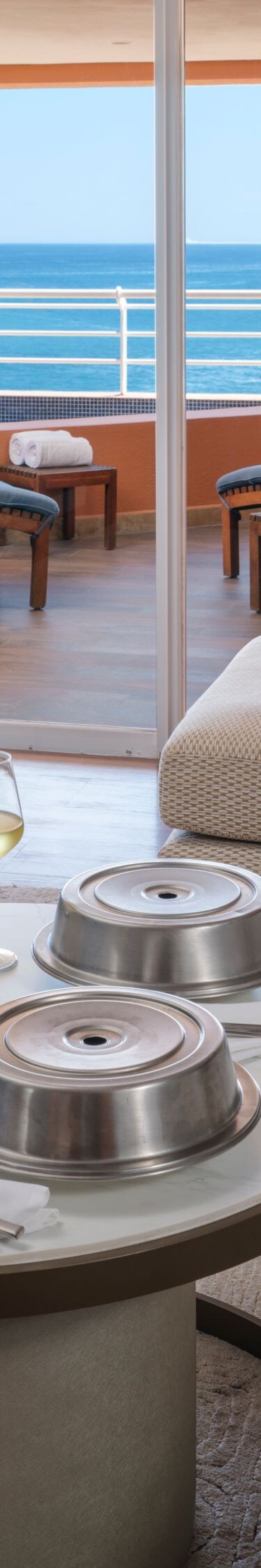 Living area with food and wine on coffee table