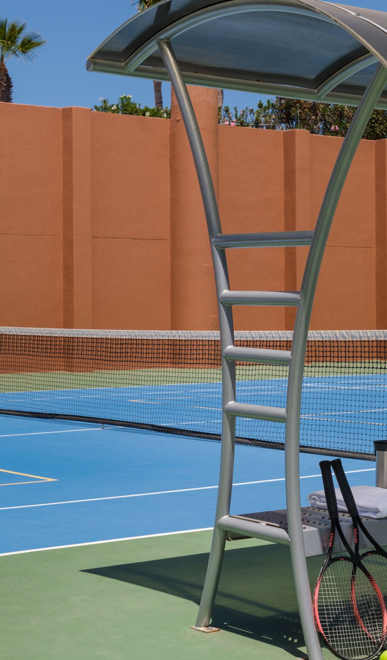 Outdoor court with tennis racquets