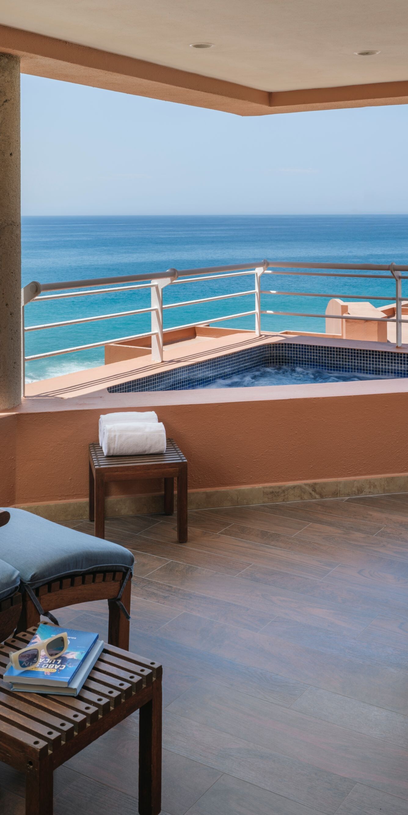 lounge chairs with ocean view on balcony