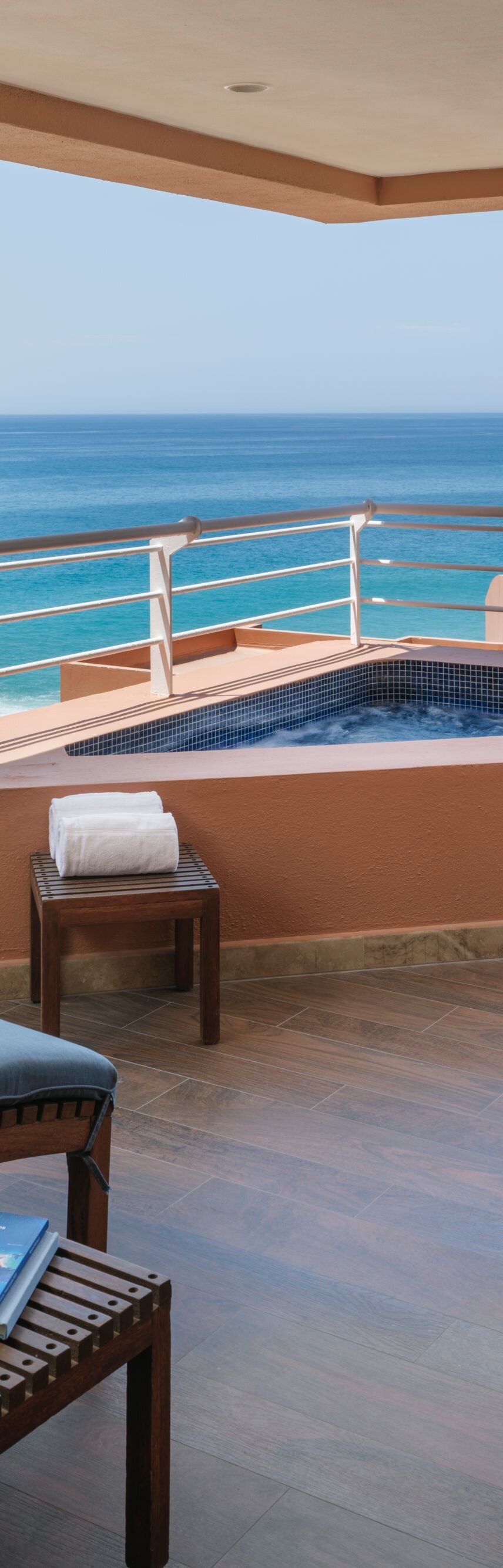 lounge chairs with ocean view on balcony