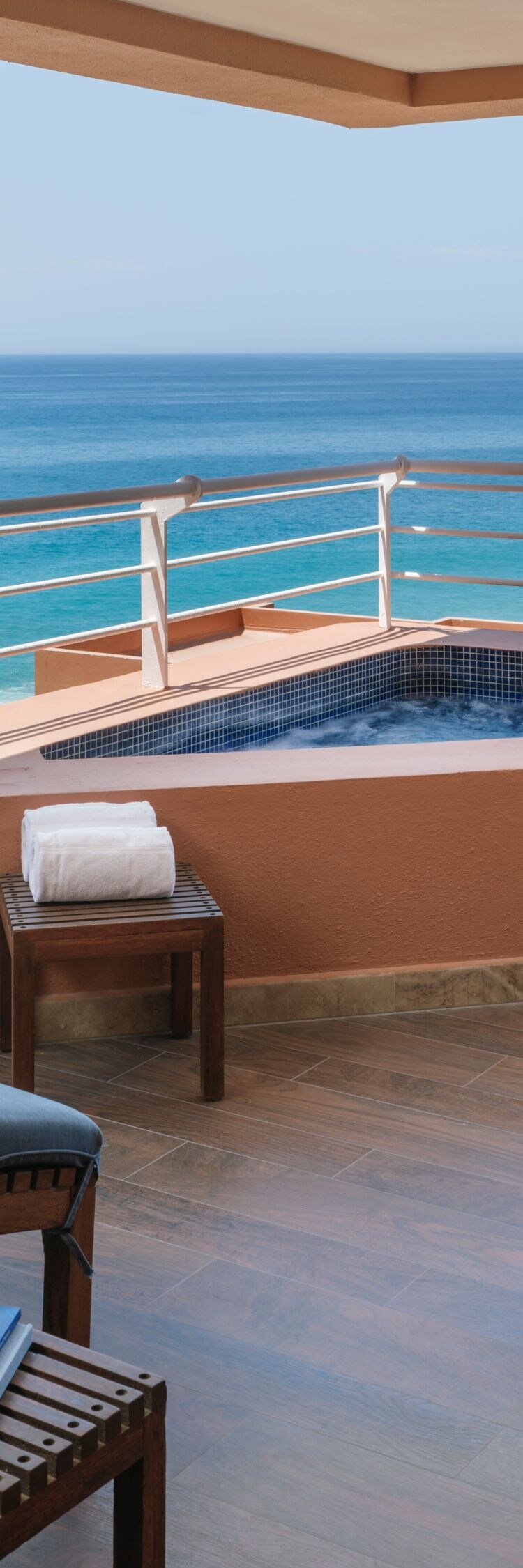 lounge chairs with ocean view on balcony