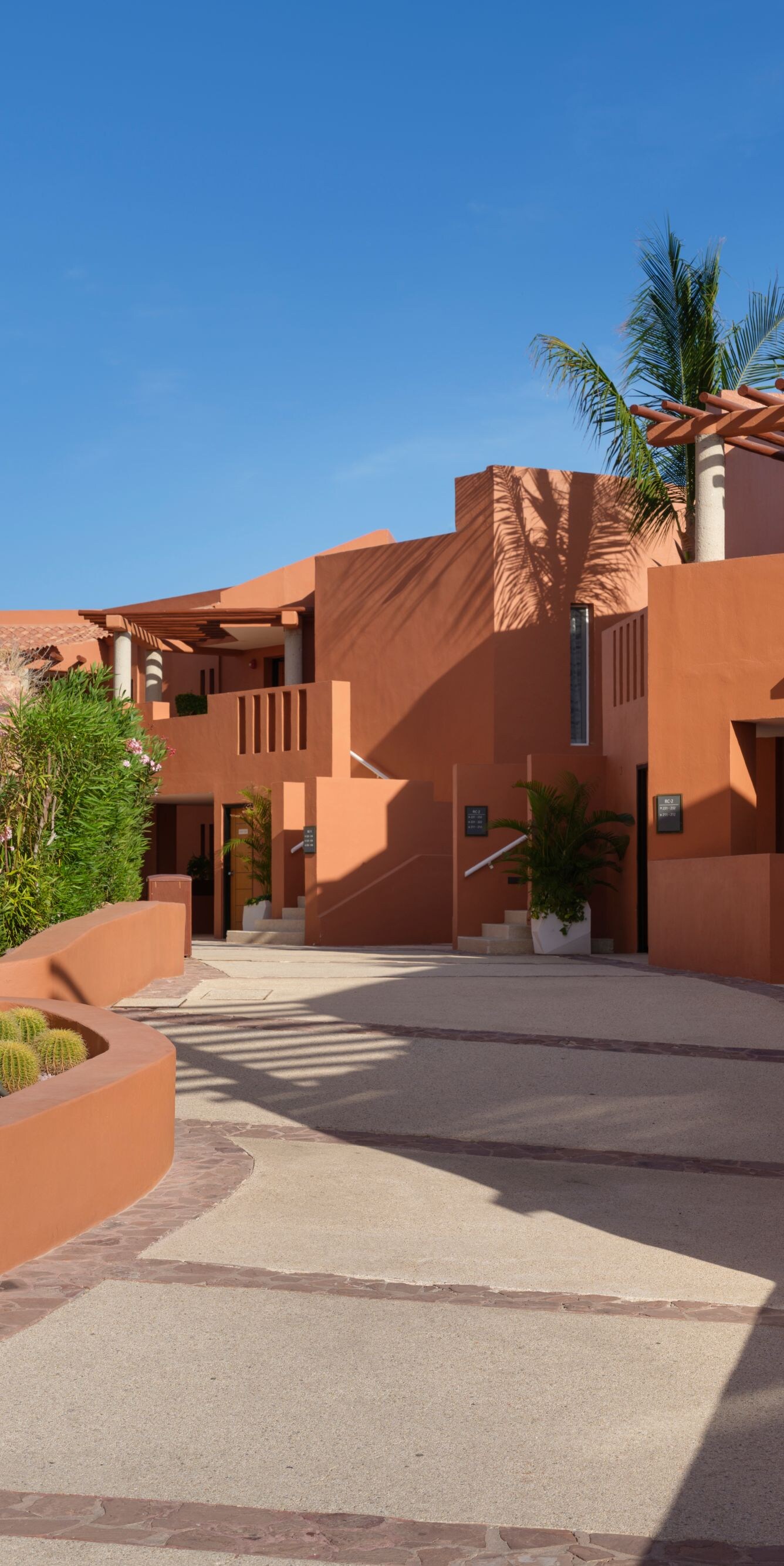 Resort walkway with desert landscaping and villas