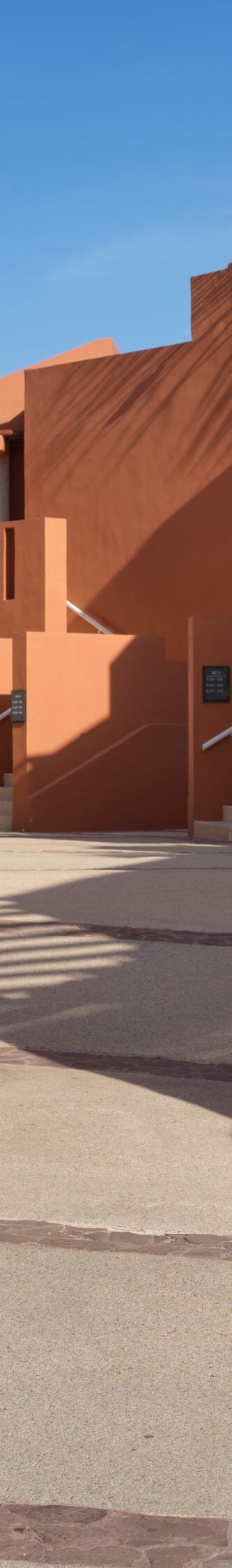 Resort walkway with desert landscaping and villas