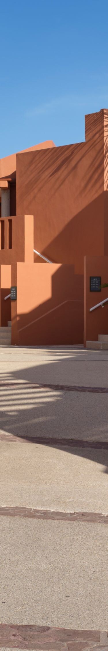Resort walkway with desert landscaping and villas