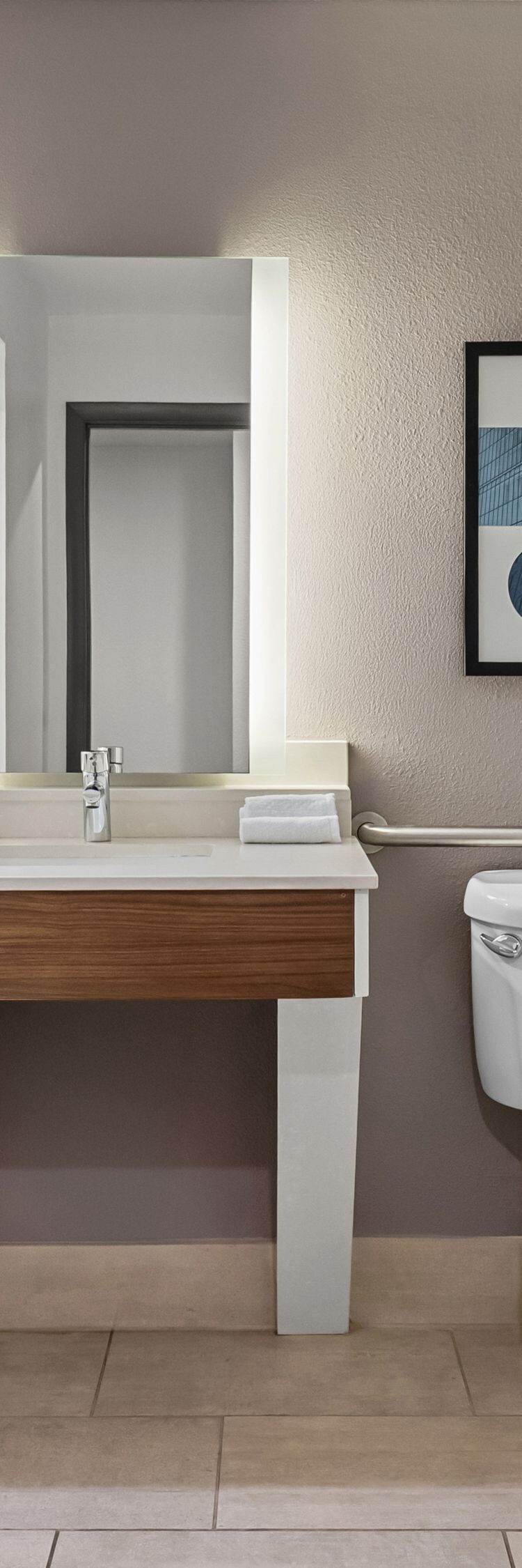 Accessible bathroom with grab bars and vanity