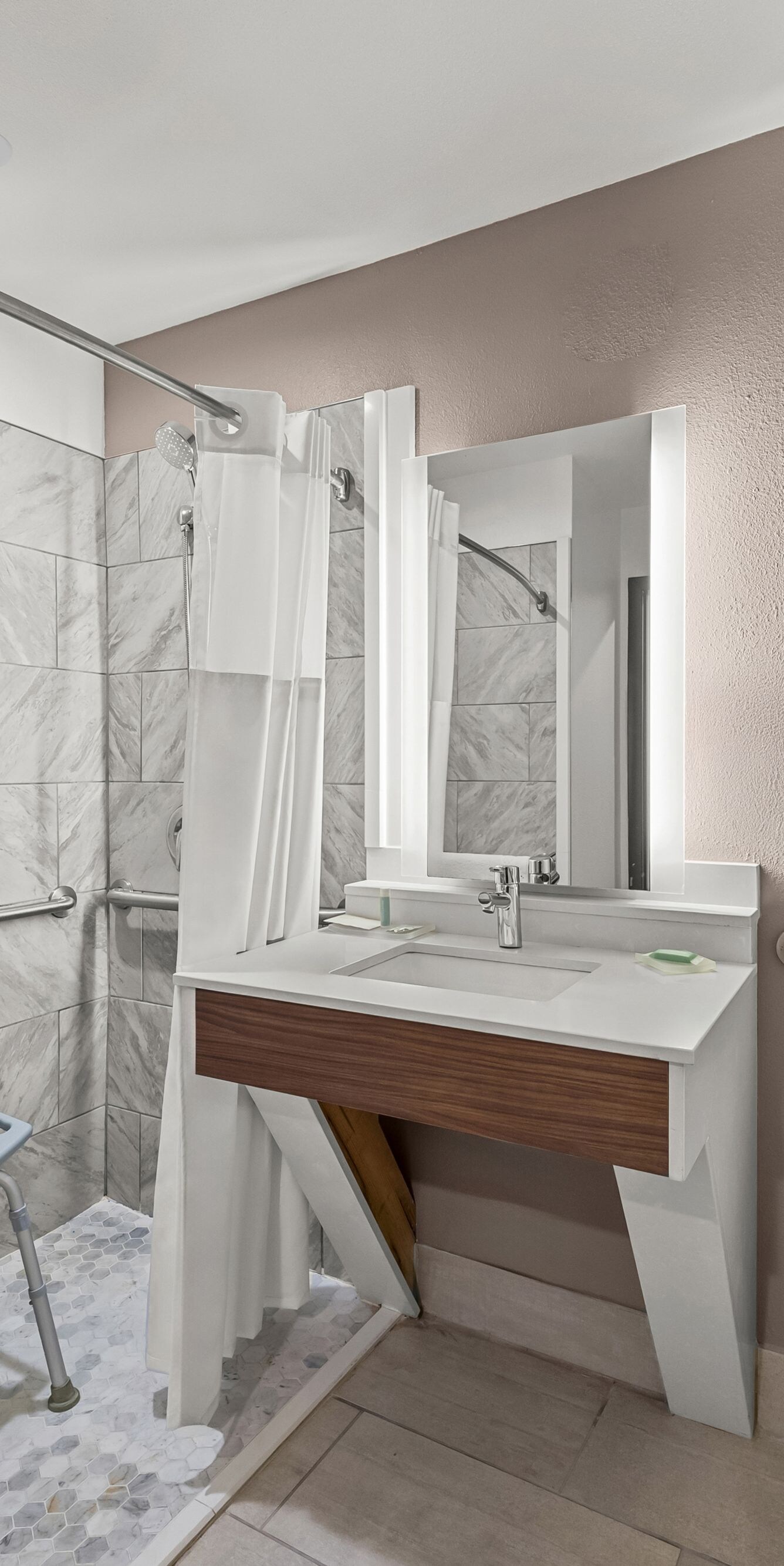 Roll-in shower with bench and grab bars