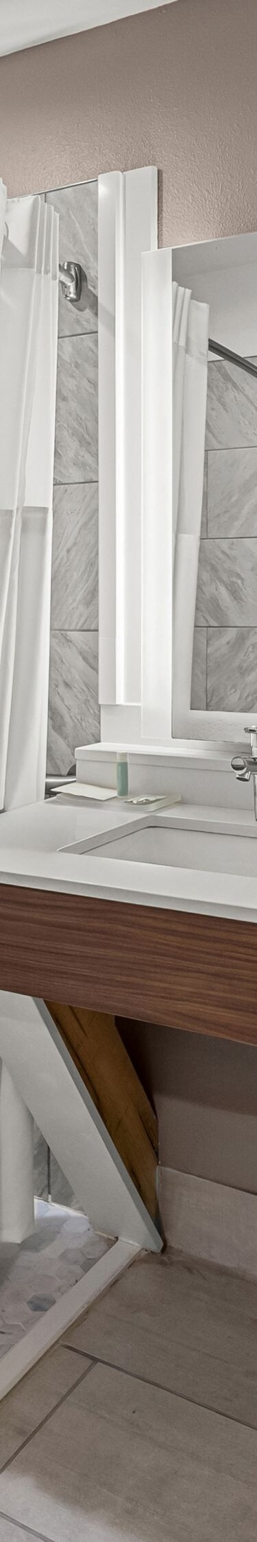 Roll-in shower with bench and grab bars