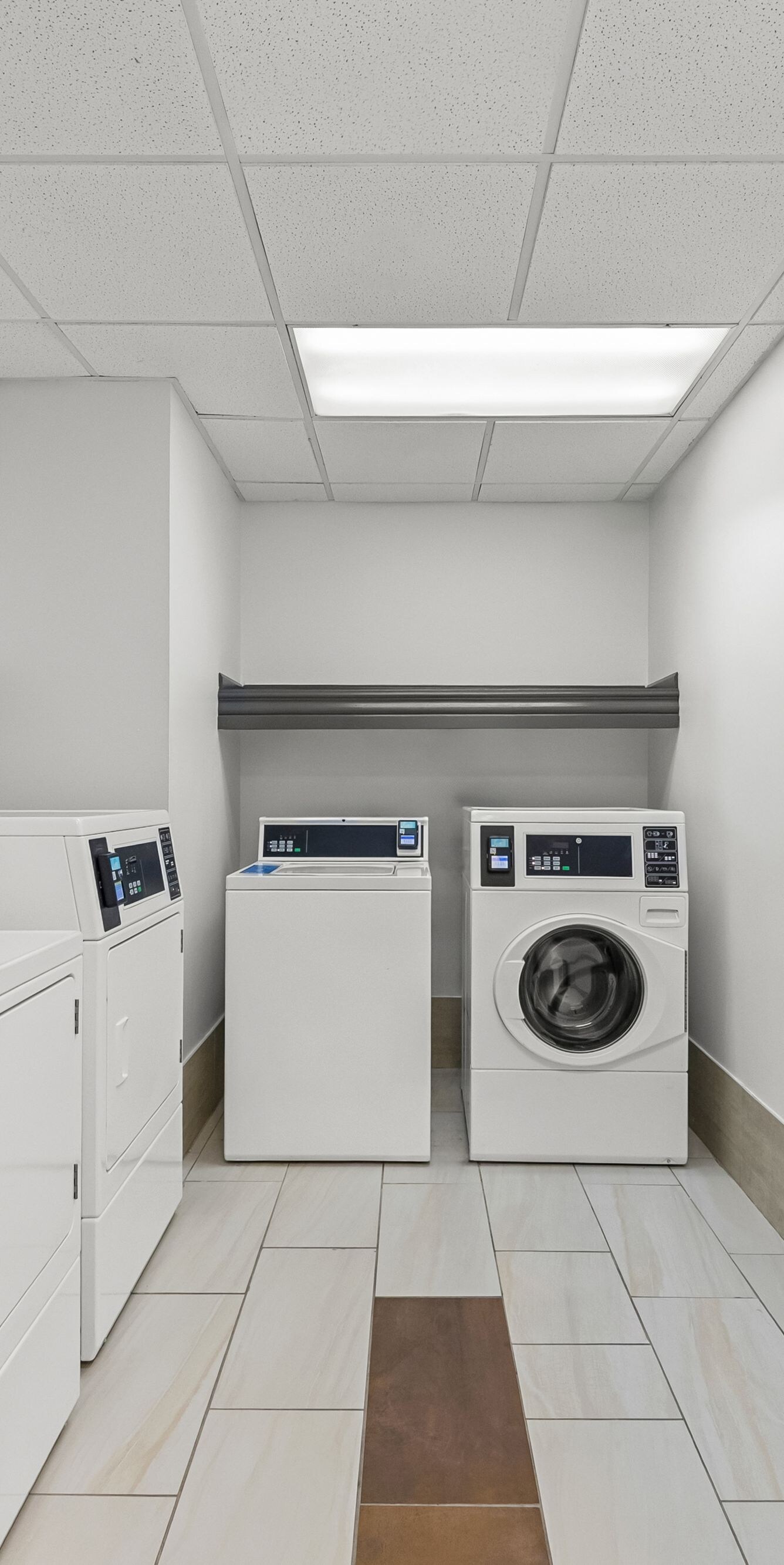 Guest laundry room with washers and dryers