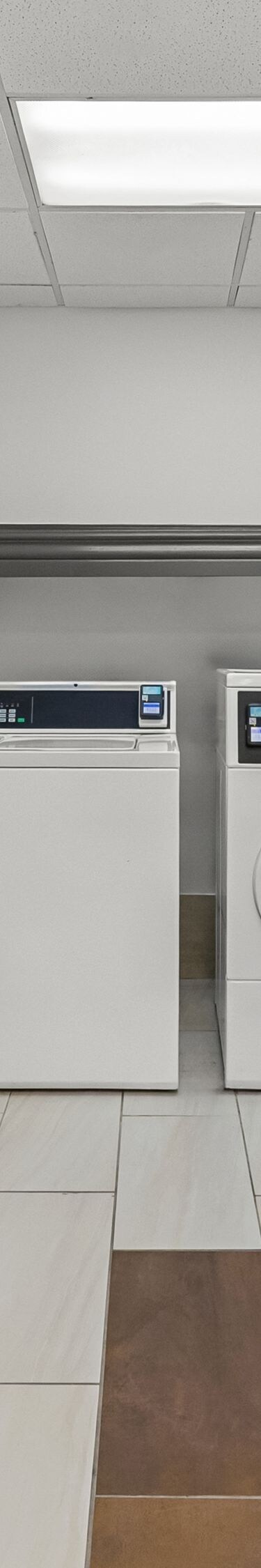 Guest laundry room with washers and dryers