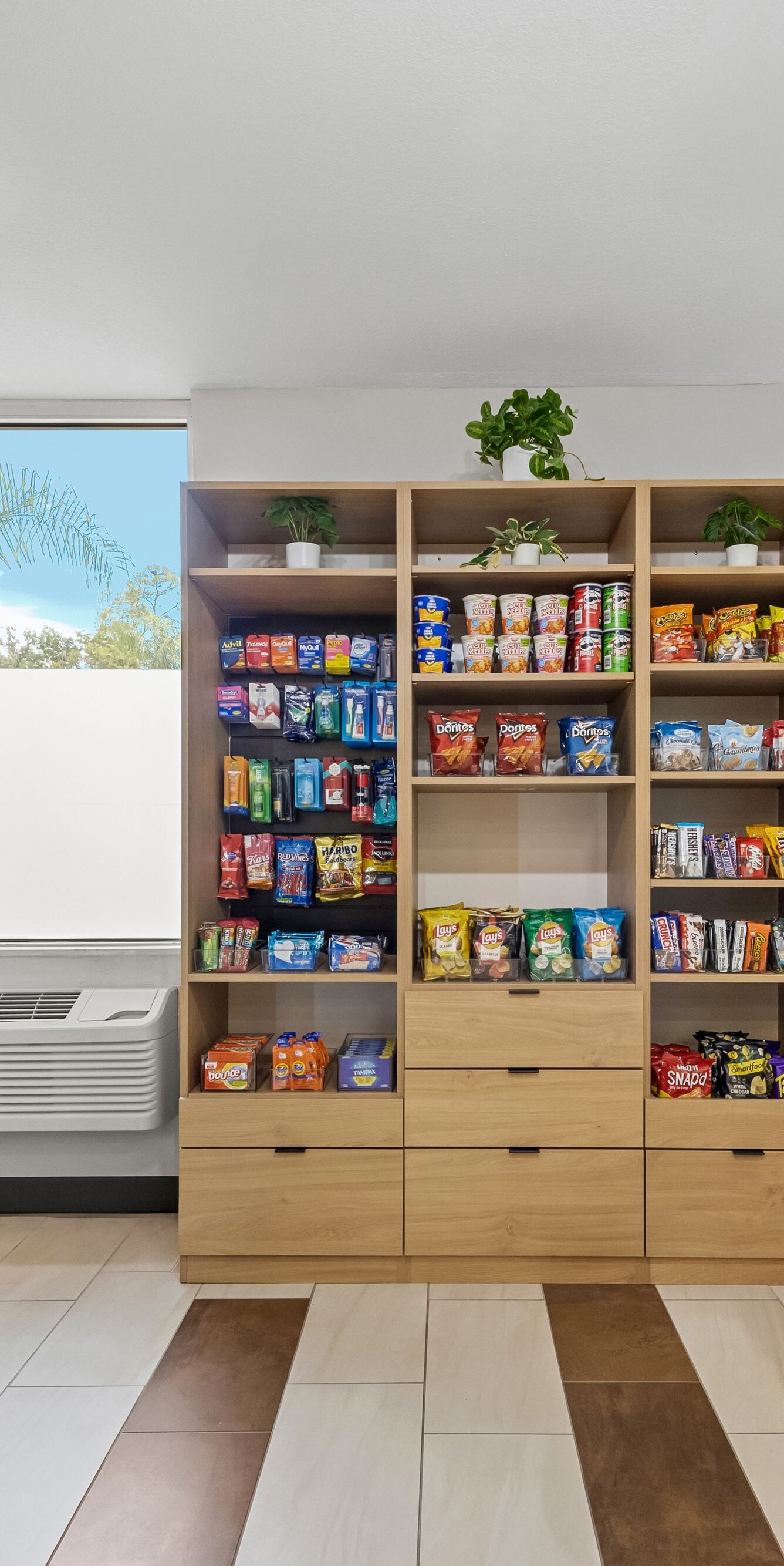 Market with coolers, snacks and checkout kiosk