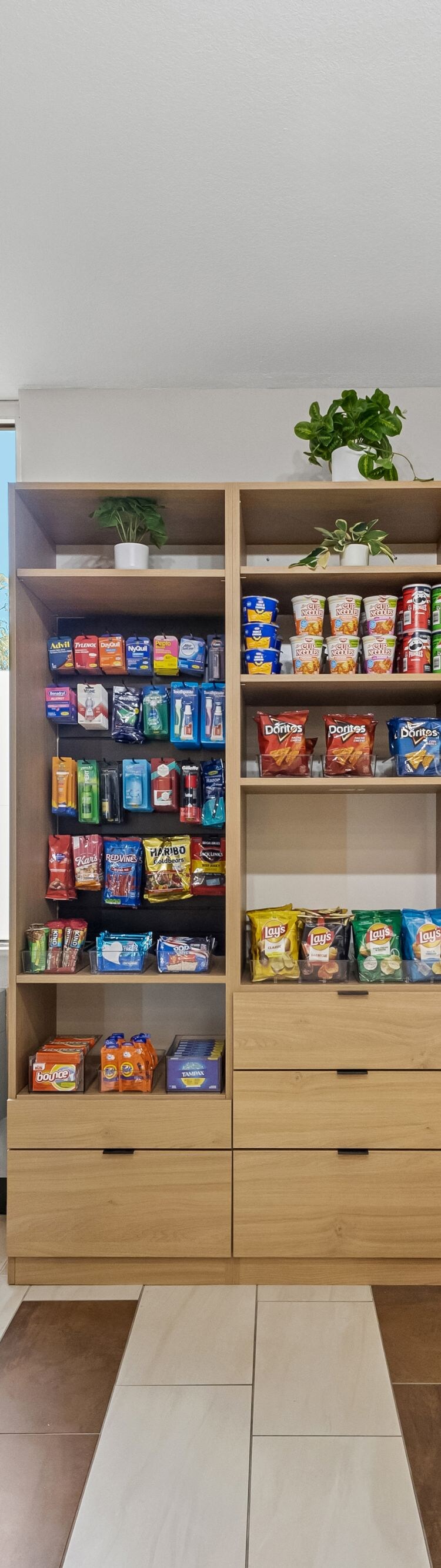 Market with coolers, snacks and checkout kiosk