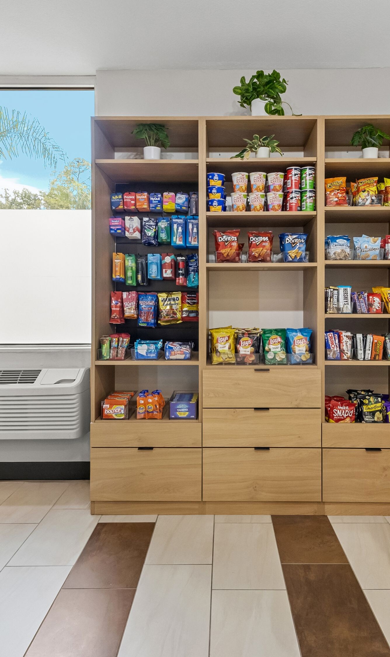 Market with coolers, snacks and checkout kiosk