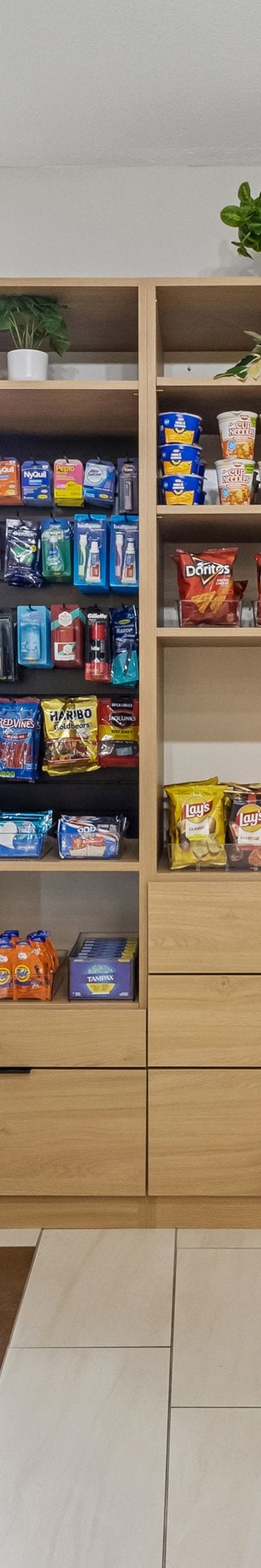 Market with coolers, snacks and checkout kiosk