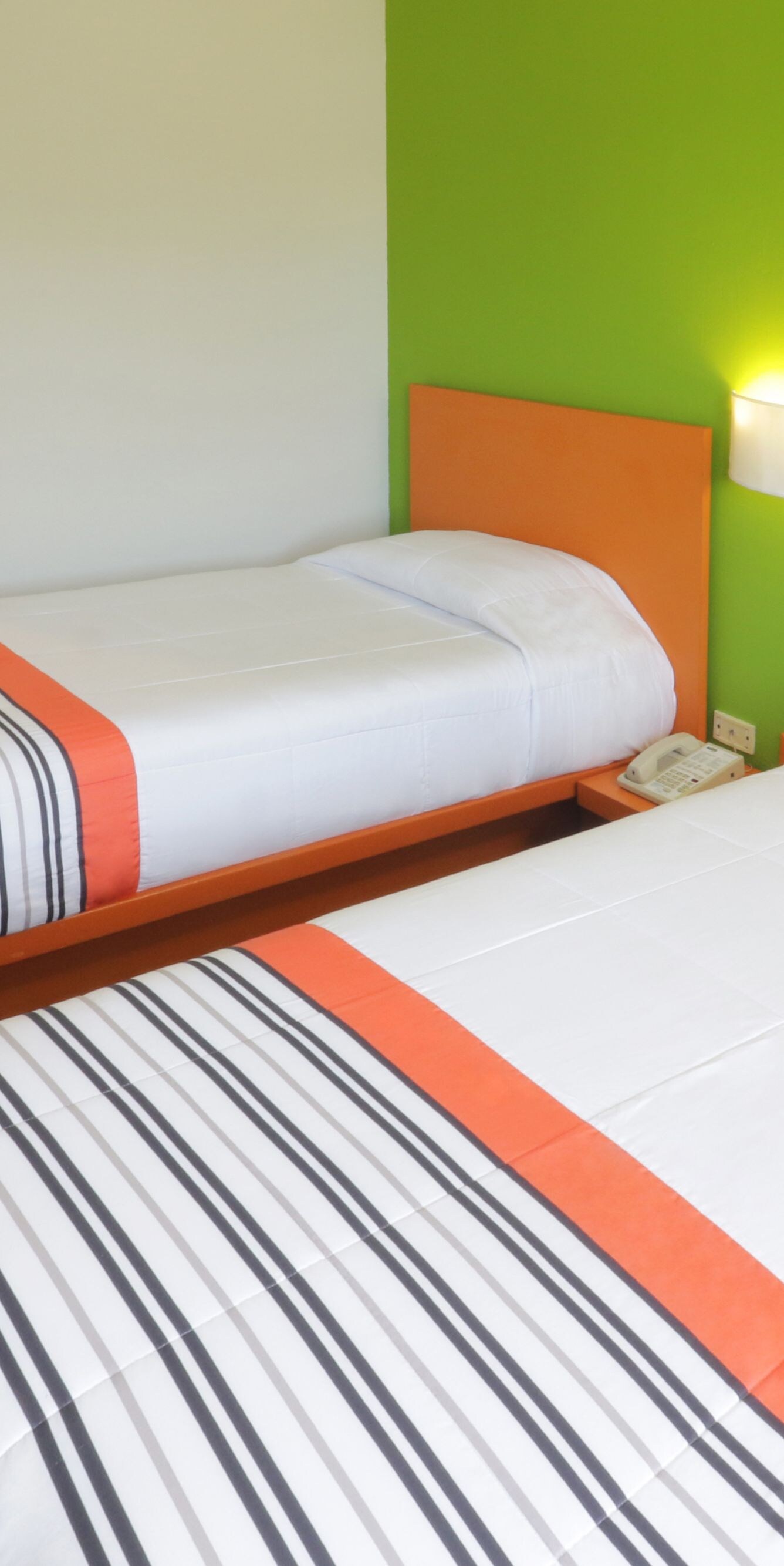 Guest room in Toluca with two twin single beds.