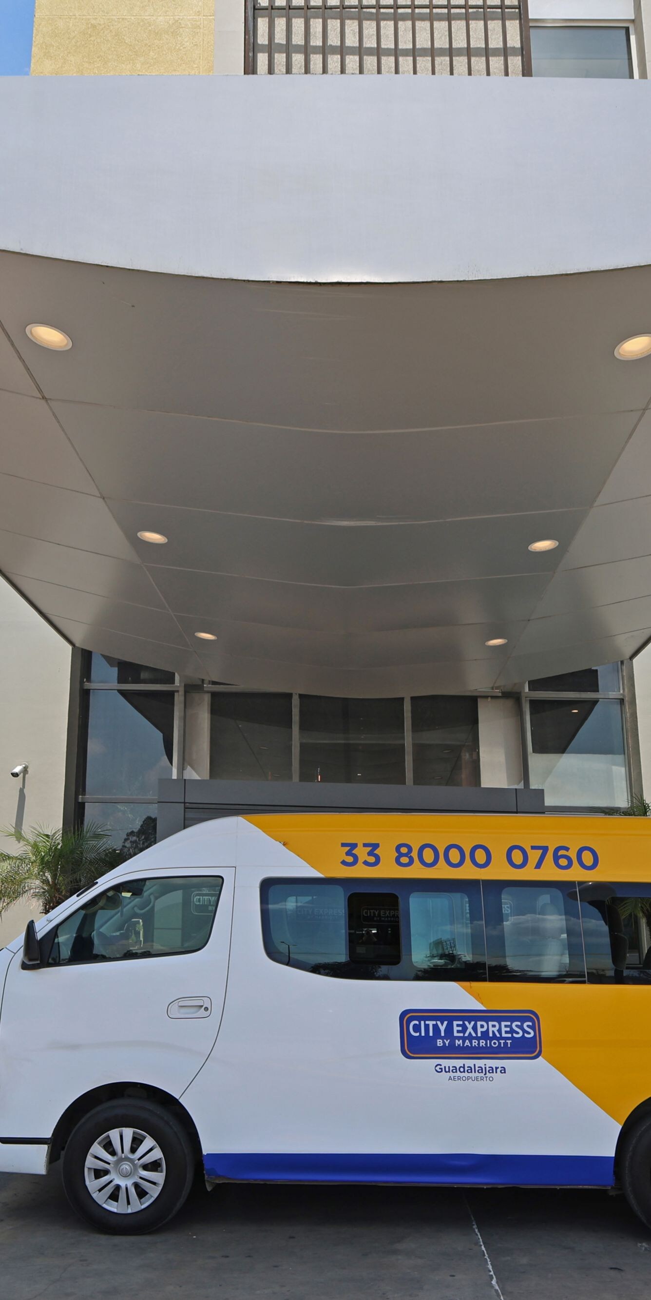 shuttle van parked at hotel entrance