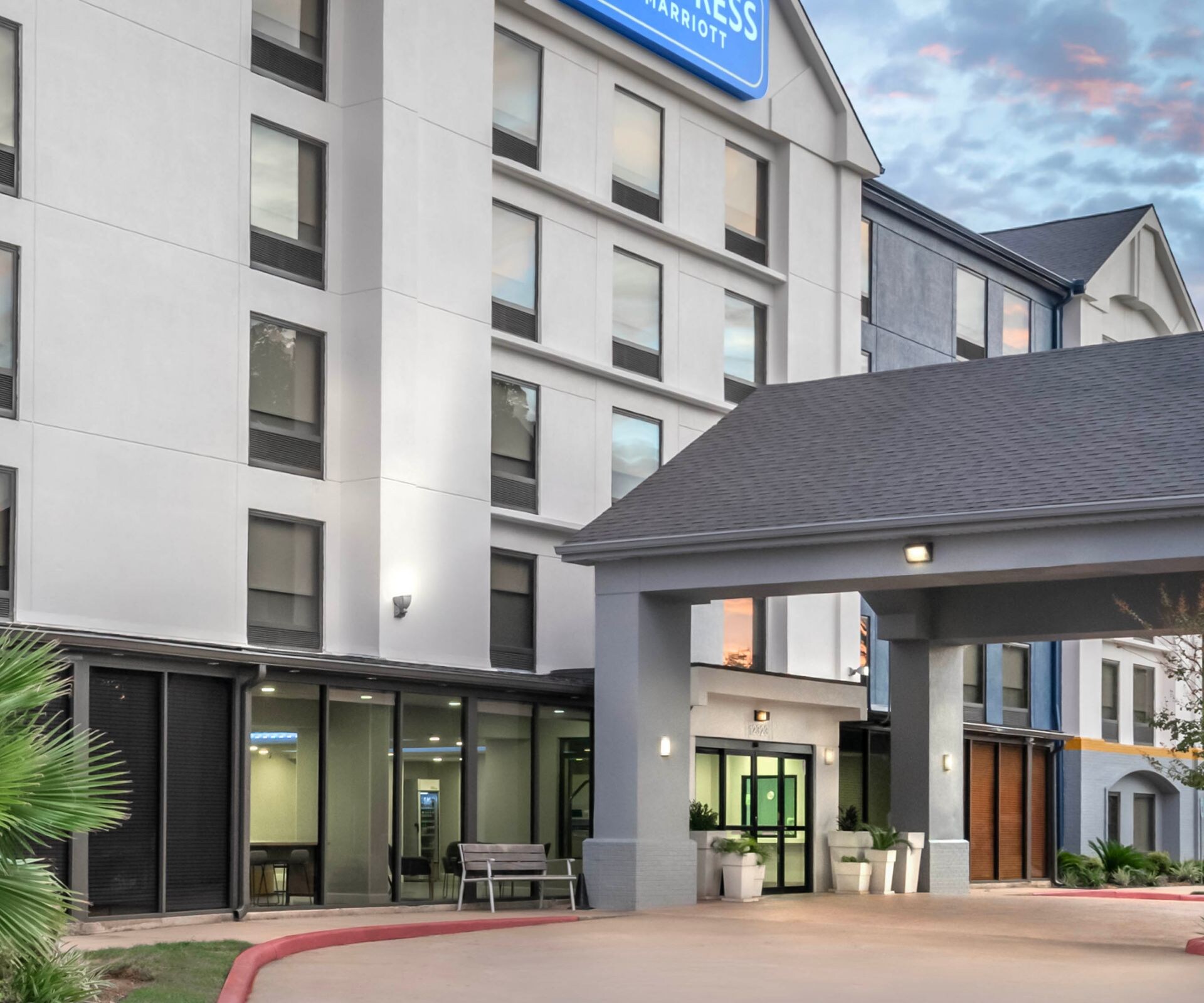 Hotel entrance and exterior at dusk