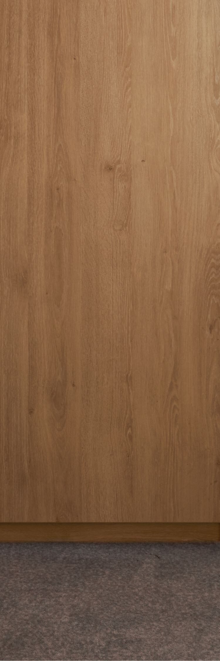 Mini fridge built into wooden cabinet