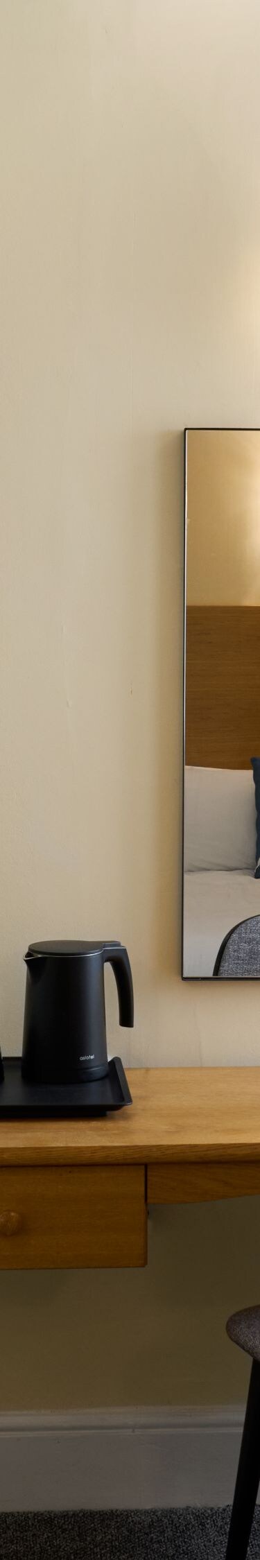 tv, desk with chair, and mirror  