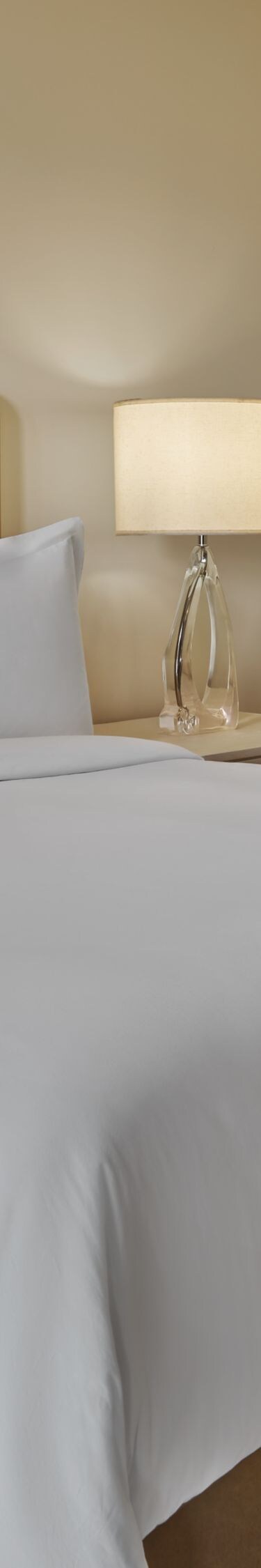 king Bedroom with nightstands and armchair