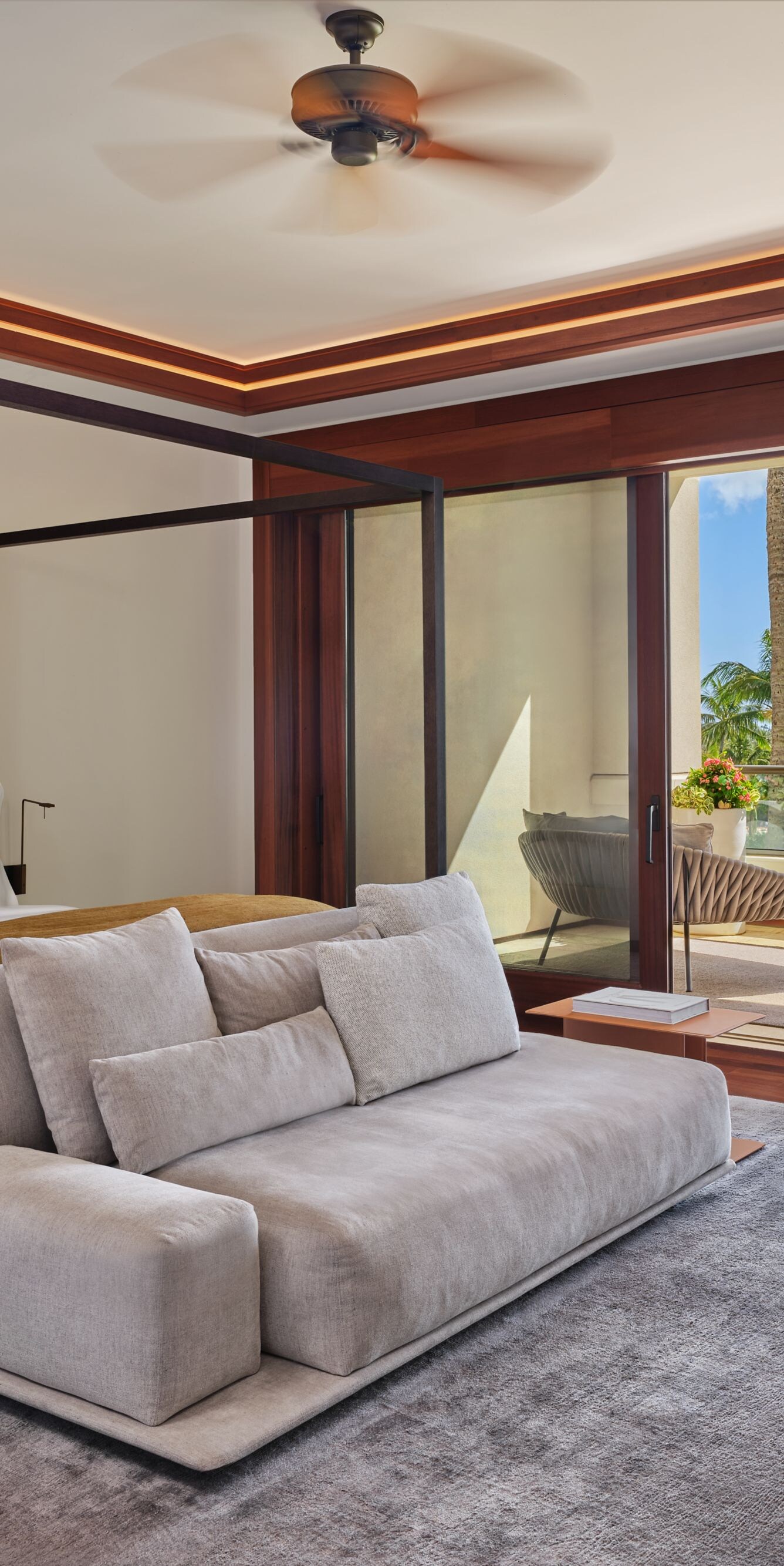 Bedroom with king bed, sofa seating, area rug, and