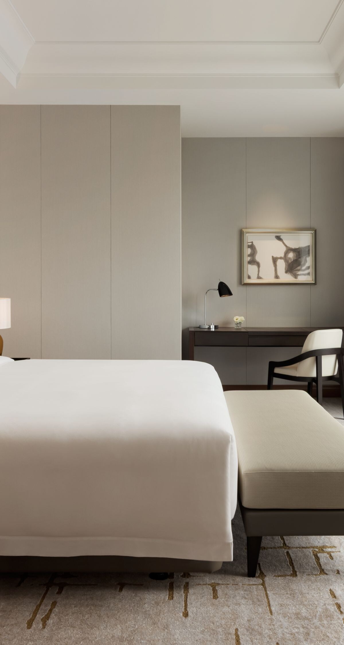 bed, bench, nightstand, desk, and city view