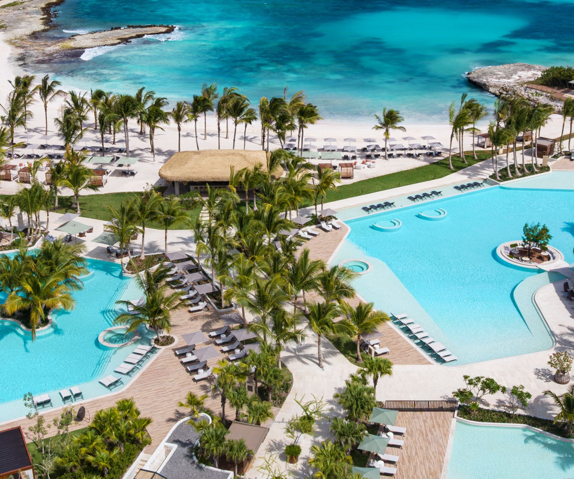 Aerial view of the resort pools and ocean