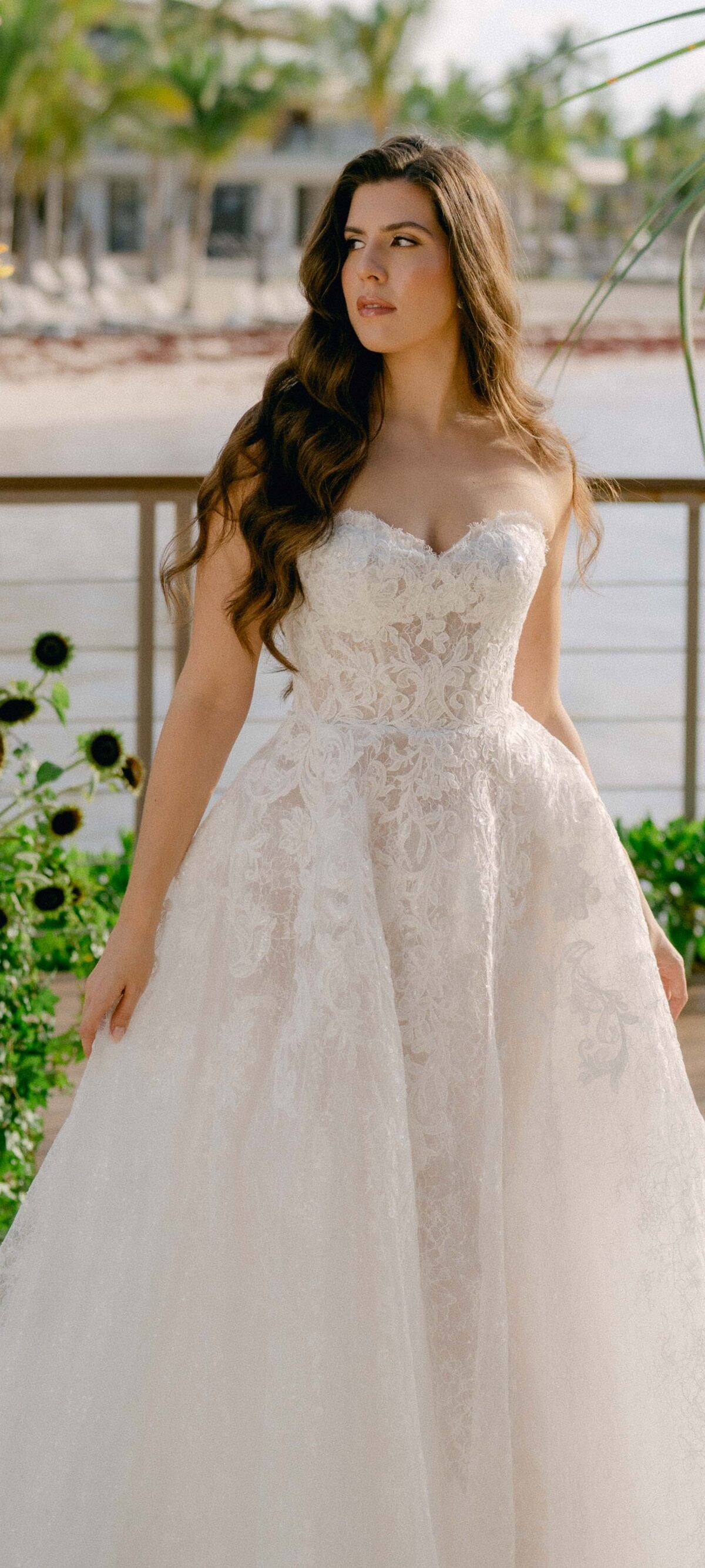 bride standing at oceanfront terrace