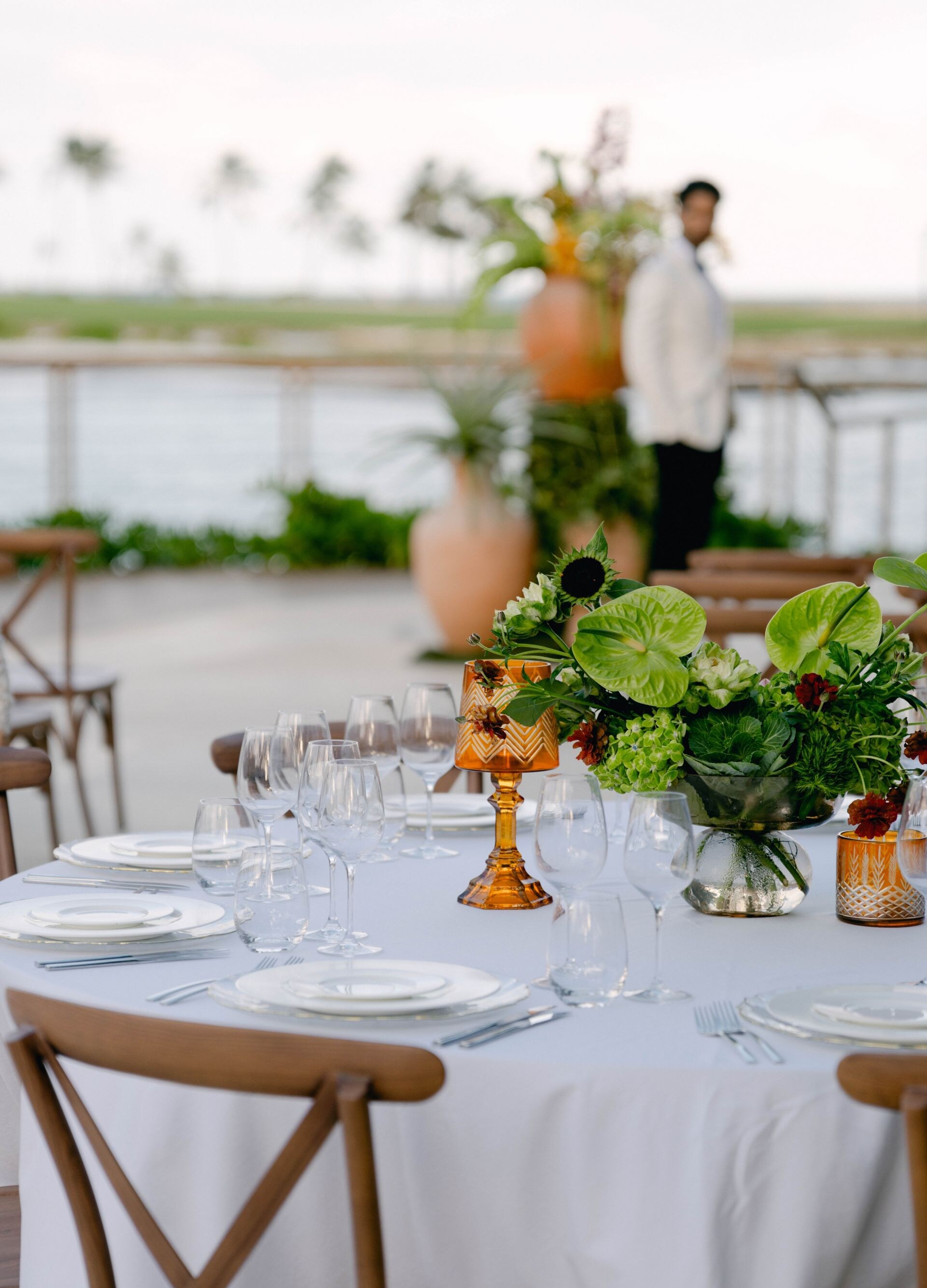 Wedding reception table with greenery, ocean view